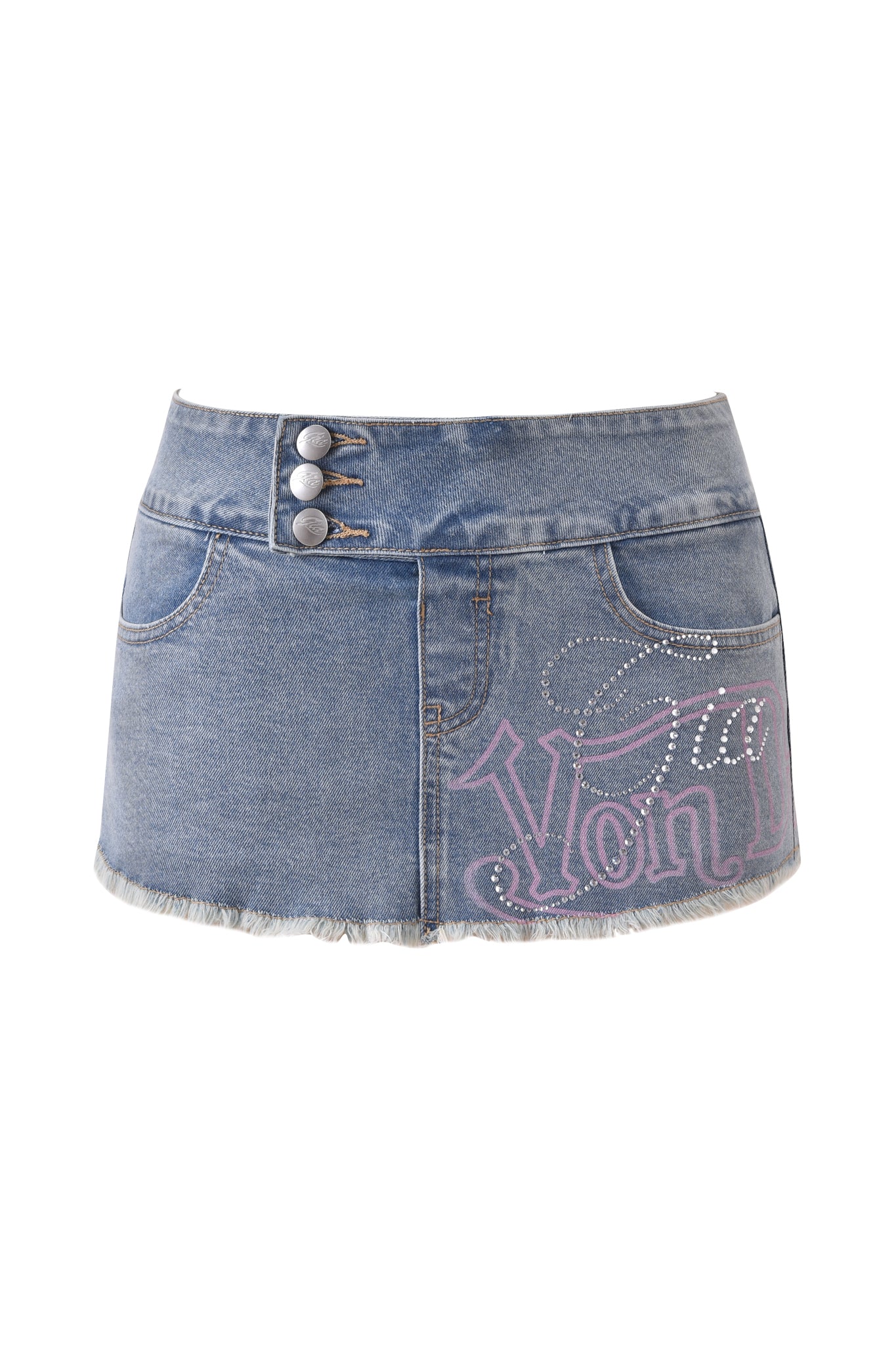 The I.AM.GIA X VON DUTCH SYNDRA DENIM MINI SKORT in light wash features a low-rise waist, frayed hem, front pockets, double silver buttons, and pink rhinestone "Von" detail for a bold collab look.