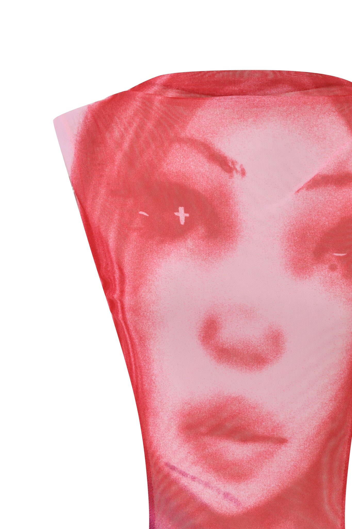 A close-up of the I.AM.GIA T-REX CORALINE MINI DRESS in pink showcases its pink and red translucent fabric, adorned with a stylized, airbrushed face featuring full lips and dark eyes. The fabric is stretched across the dress, slightly distorting the portrait for a bold look—perfect for standing out at any festival.