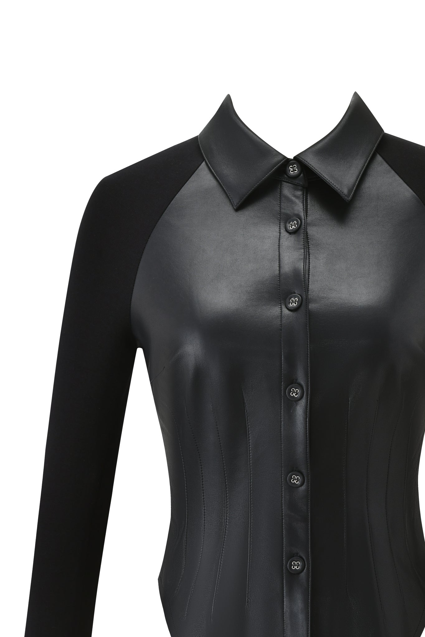 Close-up of the HELIX TOP - BLACK by I.AM.GIA, a faux leather shirt featuring a button-down closure, pointed collar, bodycon fit, and contrasting matte fabric on the long sleeves and back for a chic, modern look.