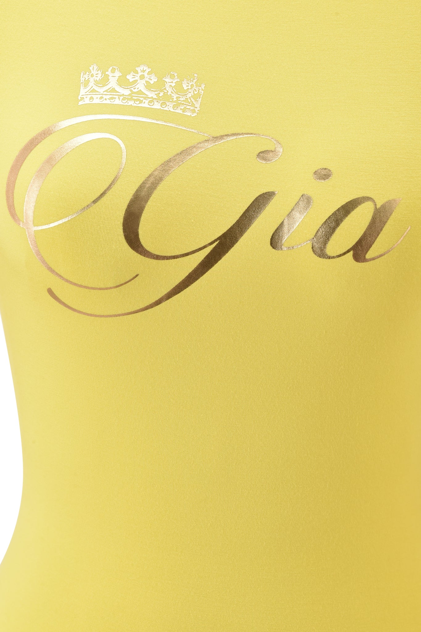 Close-up of the I.AM.GIA BLARE FORM TEE - YELLOW GOLD FOIL: a yellow bamboo baby tee with "Gia" in shiny gold script and a decorative gold crown above the "G.