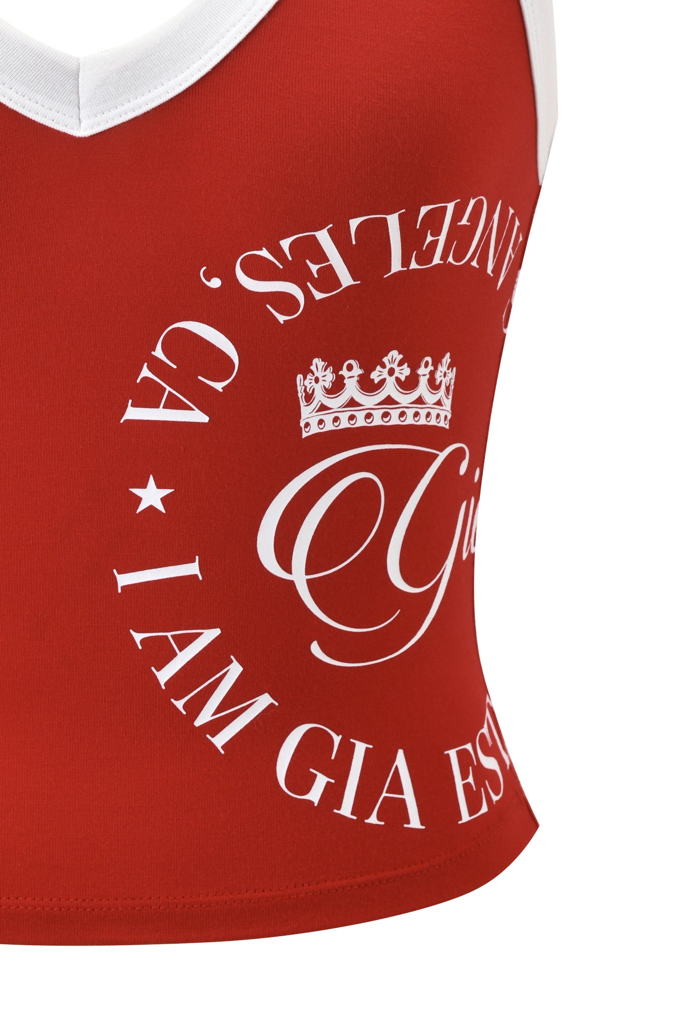 A close-up of the I.AM.GIA BLARE BIND TANK - RED, a sporty tank with white trim and circular white text reading "LOS ANGELES, CA. I AM GIA EST." plus a crown graphic above "Gia".