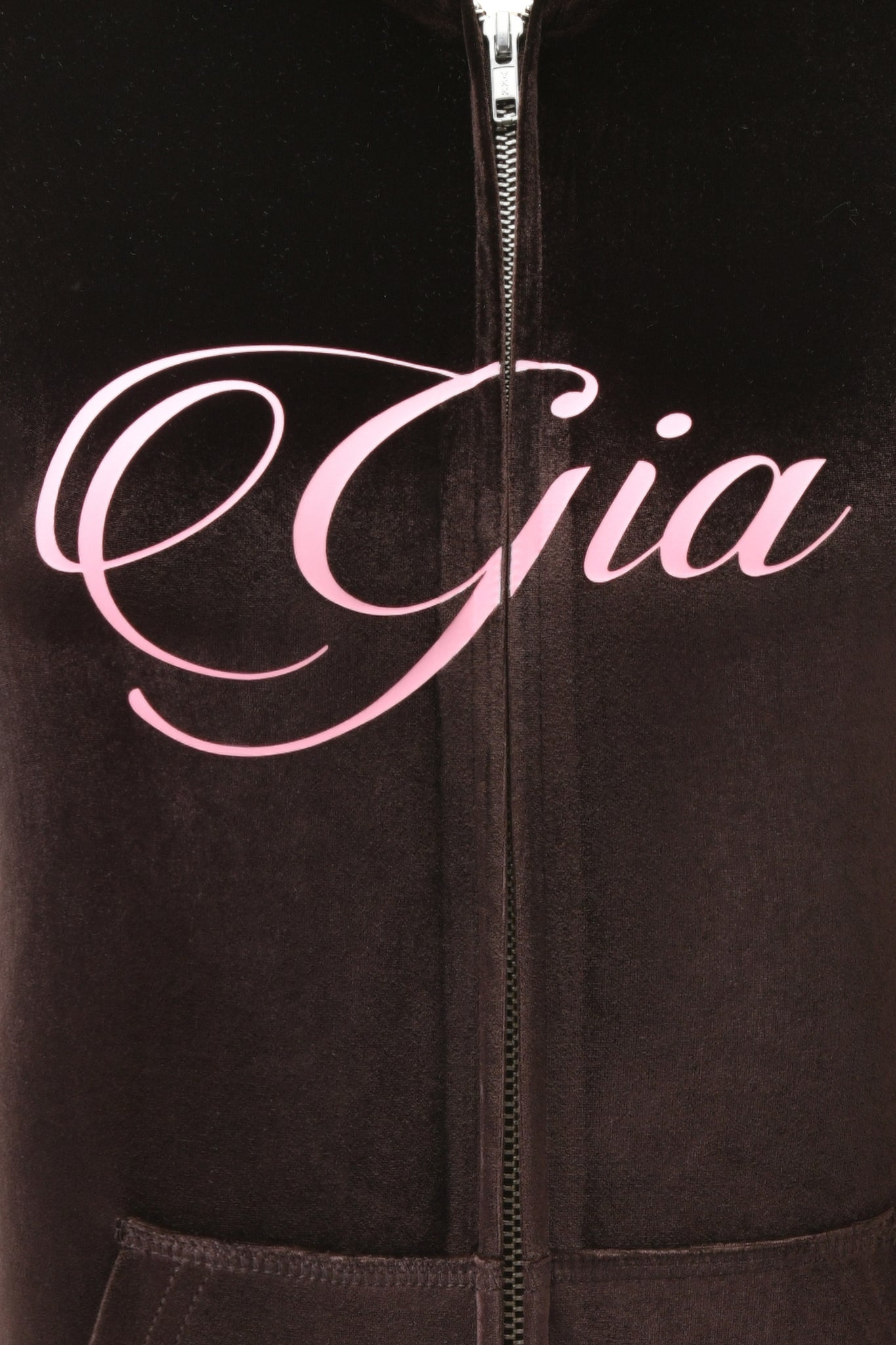 Close-up of the I.AM.GIA BLARE VELOUR POCKET HOODIE in chocolate, featuring a large pink GIA script logo across the chest and sparkling diamanté angel wings on the back.