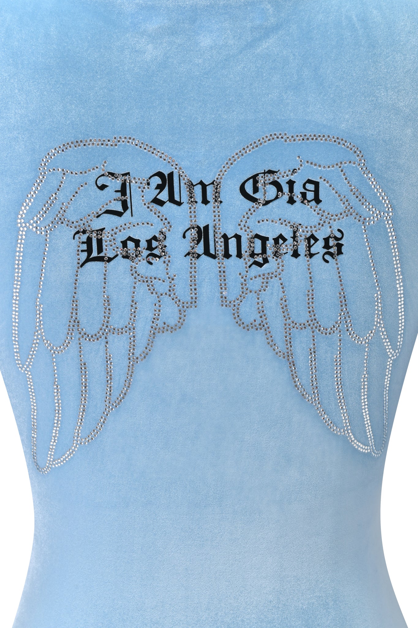 The BLARE VELOUR POCKET HOODIE in ice blue by I.AM.GIA features diamanté angel wings and bold black gothic “I Am Gia Los Angeles” text, offering signature luxe detailing.