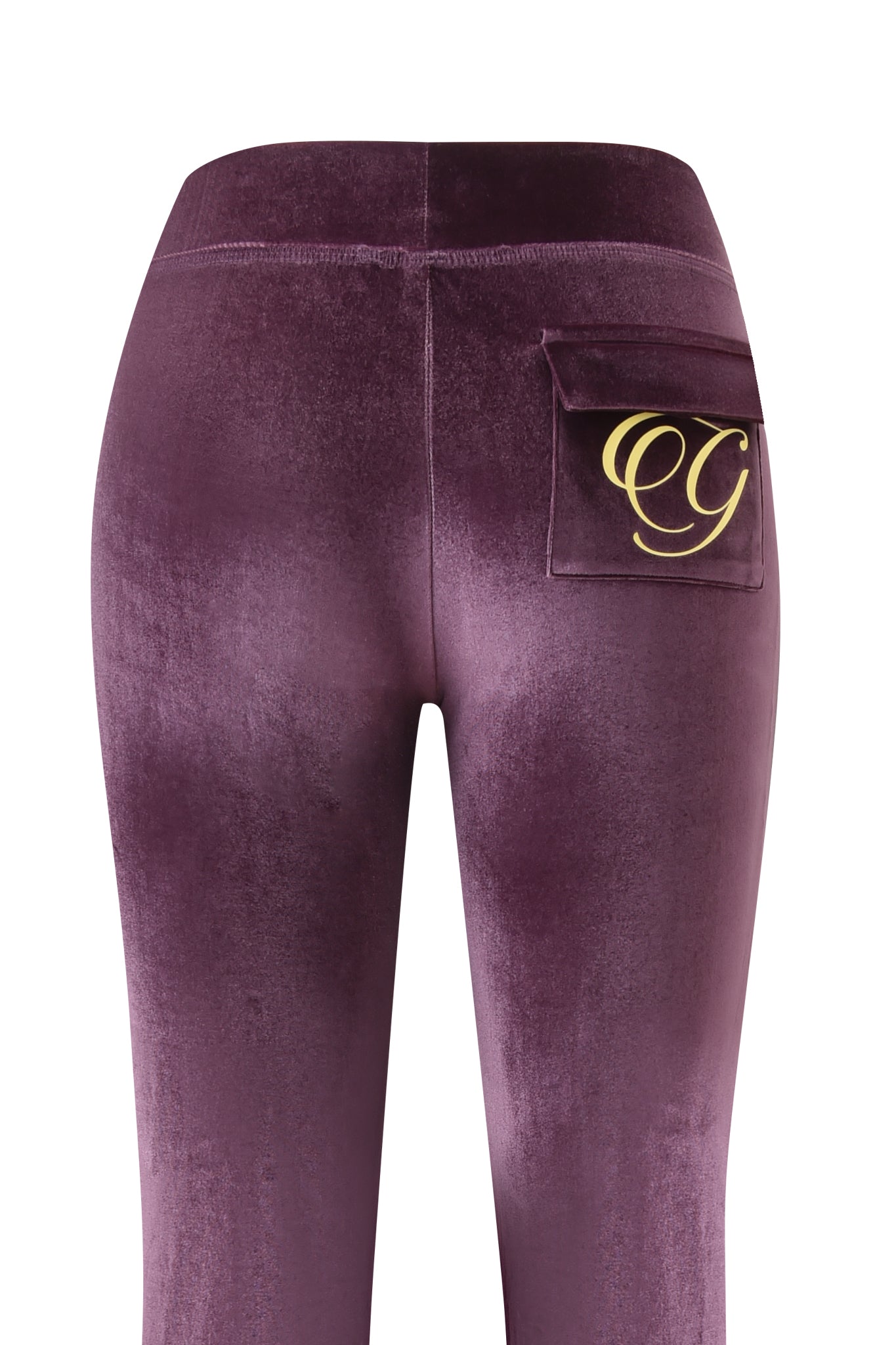 Close-up of the BLARE VELOUR POCKET TRACKPANT in purple by I.AM.GIA, showing the mid-rise waist and a single right-side pocket with gold-lettered "CG" initials.