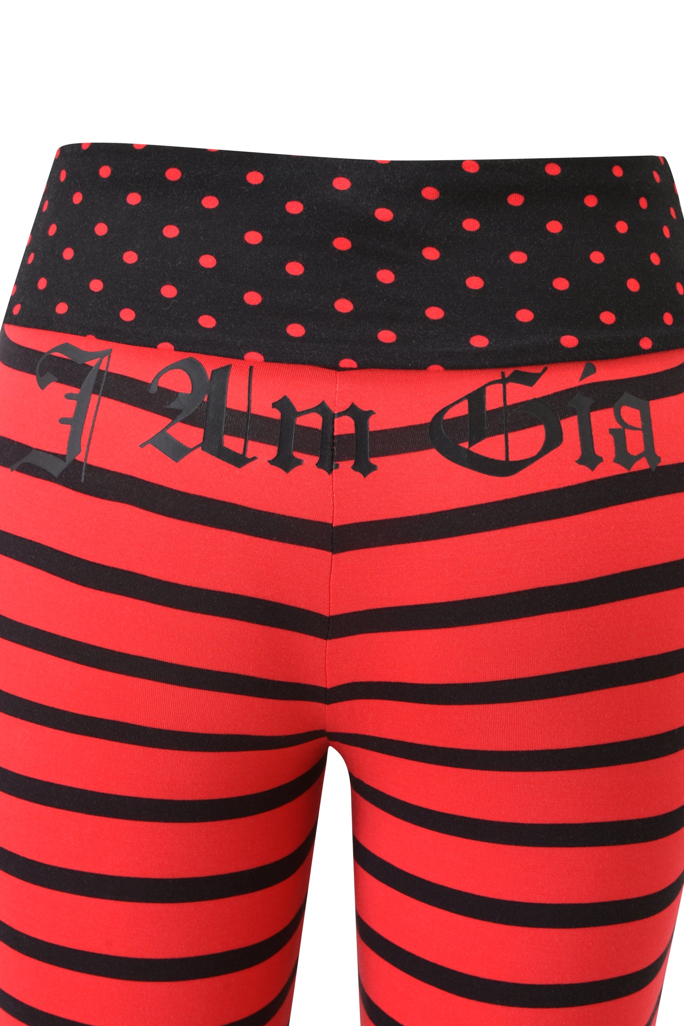 Close-up of the I.AM.GIA BLARE FOLDOVER TRACKPANT in red and black stripes, featuring a polka dot foldover waistband with bold Gothic “I AM GIA” lettering.