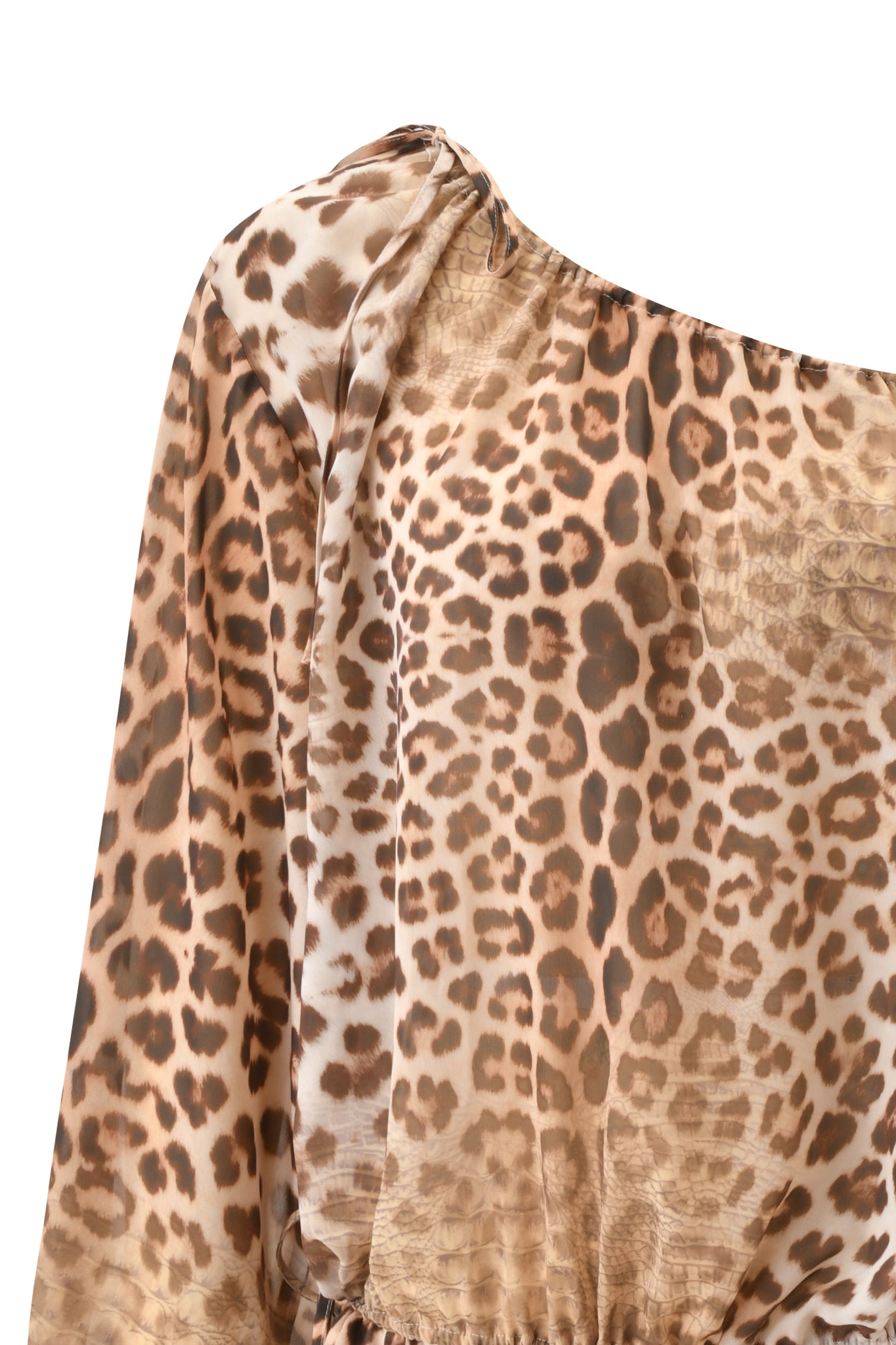 Close-up of the LUISA MINI DRESS - CROCODILE TEARS by I.AM.GIA, featuring silky georgette fabric with an animal print, a brown and beige pattern, long loose sleeve, and gathered seam detail.
