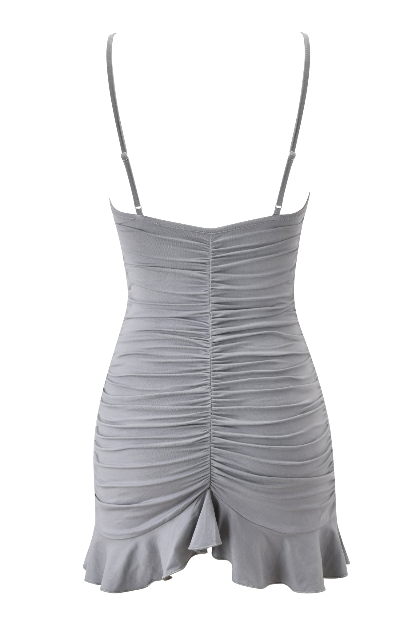 The GIULIANA MINI DRESS - SLATE by I.AM.GIA is a light gray, sleeveless bodycon mini dress with thin adjustable straps, ruched center-back detailing, and a ruffled hem.