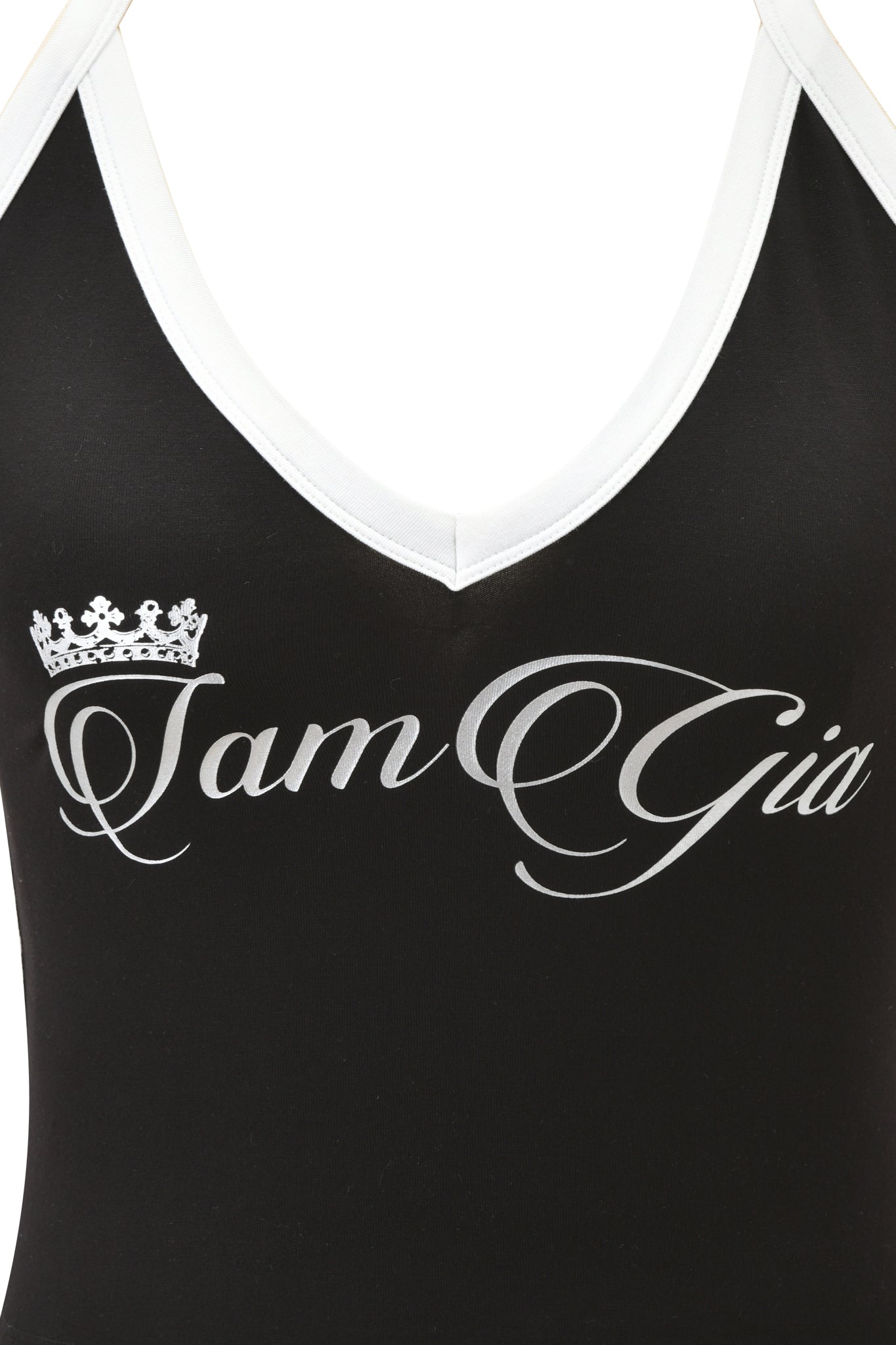 Close-up of the I.AM.GIA BLARE V-NECK TANK in black and white, featuring a body-hugging viscose fit, a white-trimmed v-neck, "I am Gia" cursive text across the chest, and a small crown graphic above the letter "I".