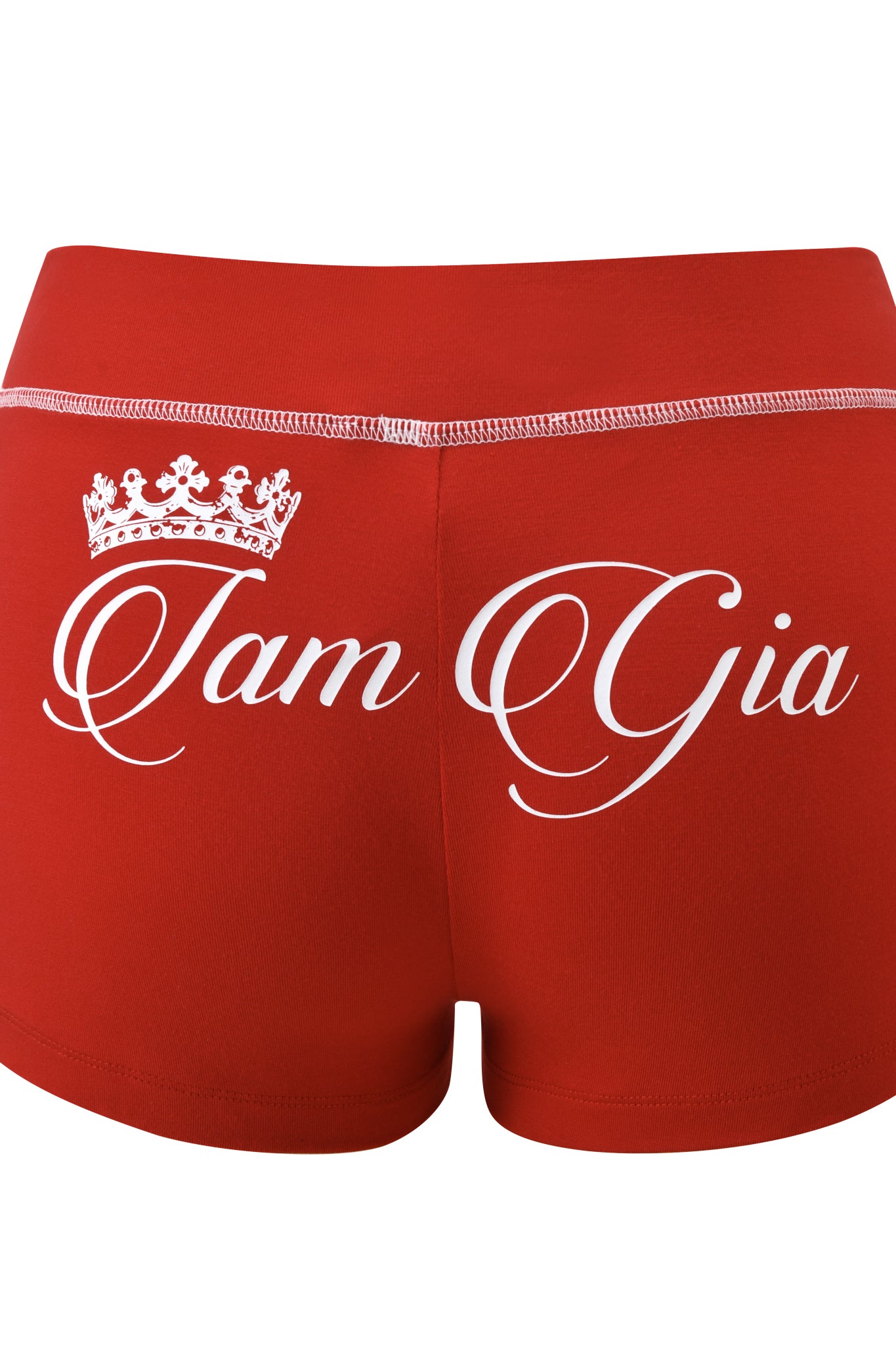 The I.AM.GIA BLARE PANELLED SHORT - RED is a red sporty micro short with white stitching and a decorative white crown above “Tam Gia” in elegant script on the back, blending comfort with bold streetwear style.