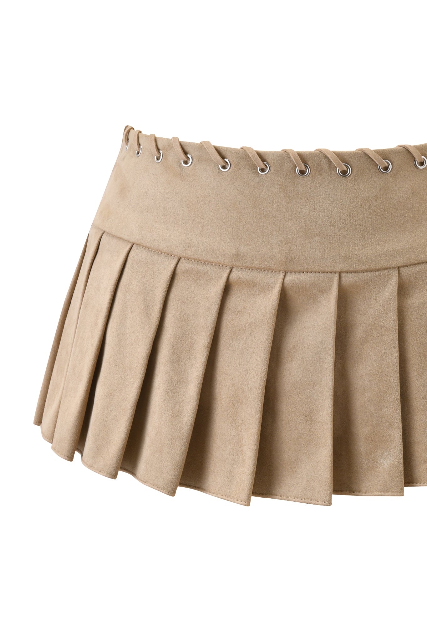 The REMINI SUEDE SKORT – TAN by I.AM.GIA features a beige faux suede pleated mini design with silver eyelets and lace-up detailing along the waistband.