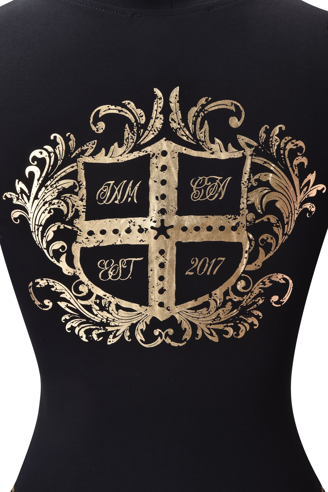 The BLARE FORM MULTI POCKET HOODIE by I.AM.GIA features a gold ornate crest with "IM," "SN," and "EST 2017" in script. The black and gold zip-up hoodie combines bold style with elegant decorative flourishes.