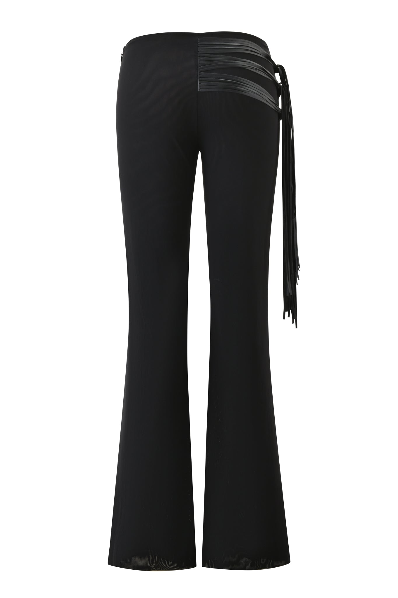 The I.AM.GIA ISELDA FRINGE PANT in black is shown from the back, highlighting a glossy faux leather panel and long faux leather fringe accent along one side near the waistband.