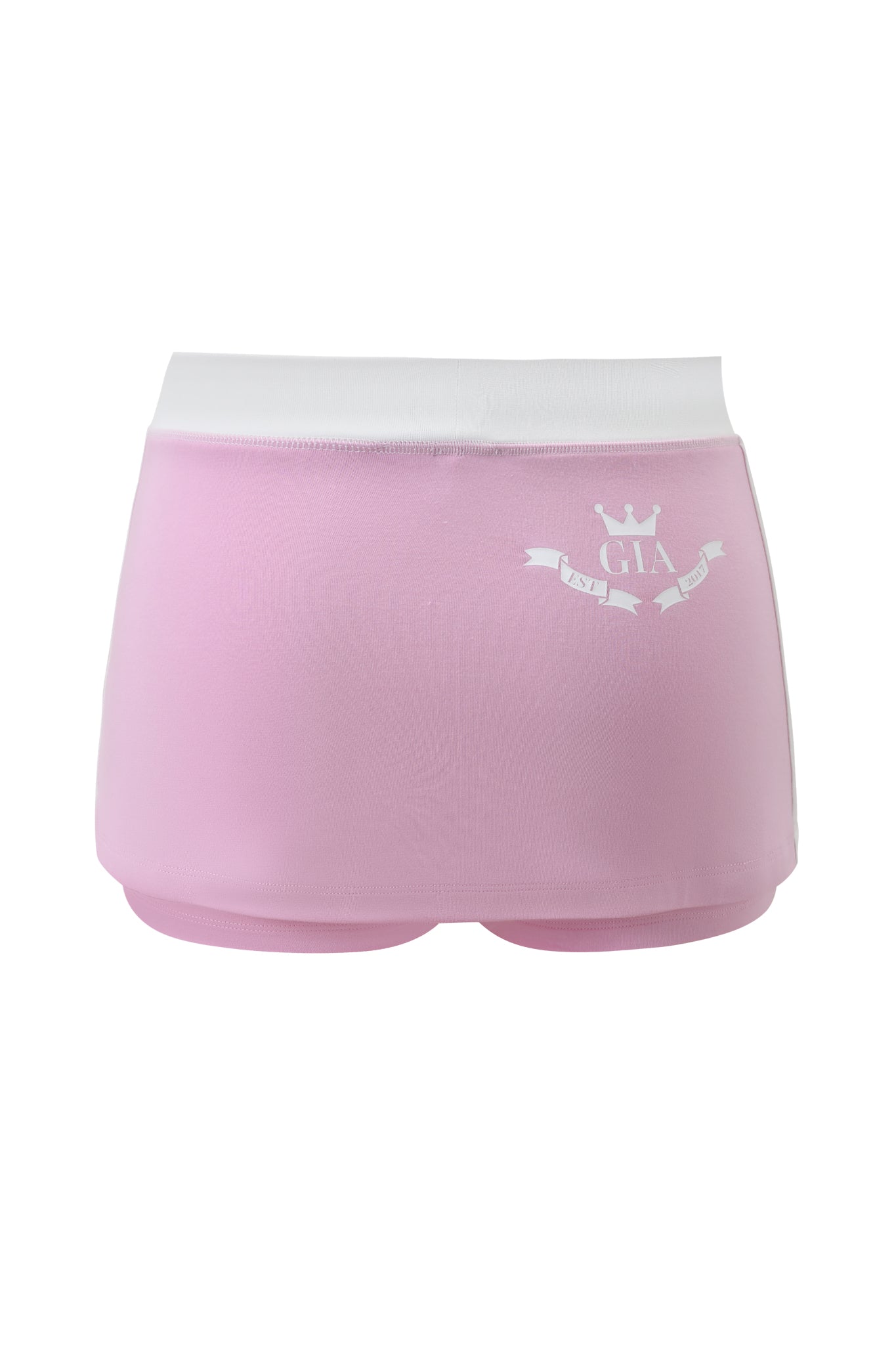The BLARE PIPING MICRO SKORT in baby pink and white by I.AM.GIA features a wide white waistband, sporty micro skort design, and small white crown with "GIA" graphic on the left side. Displayed against a white background.