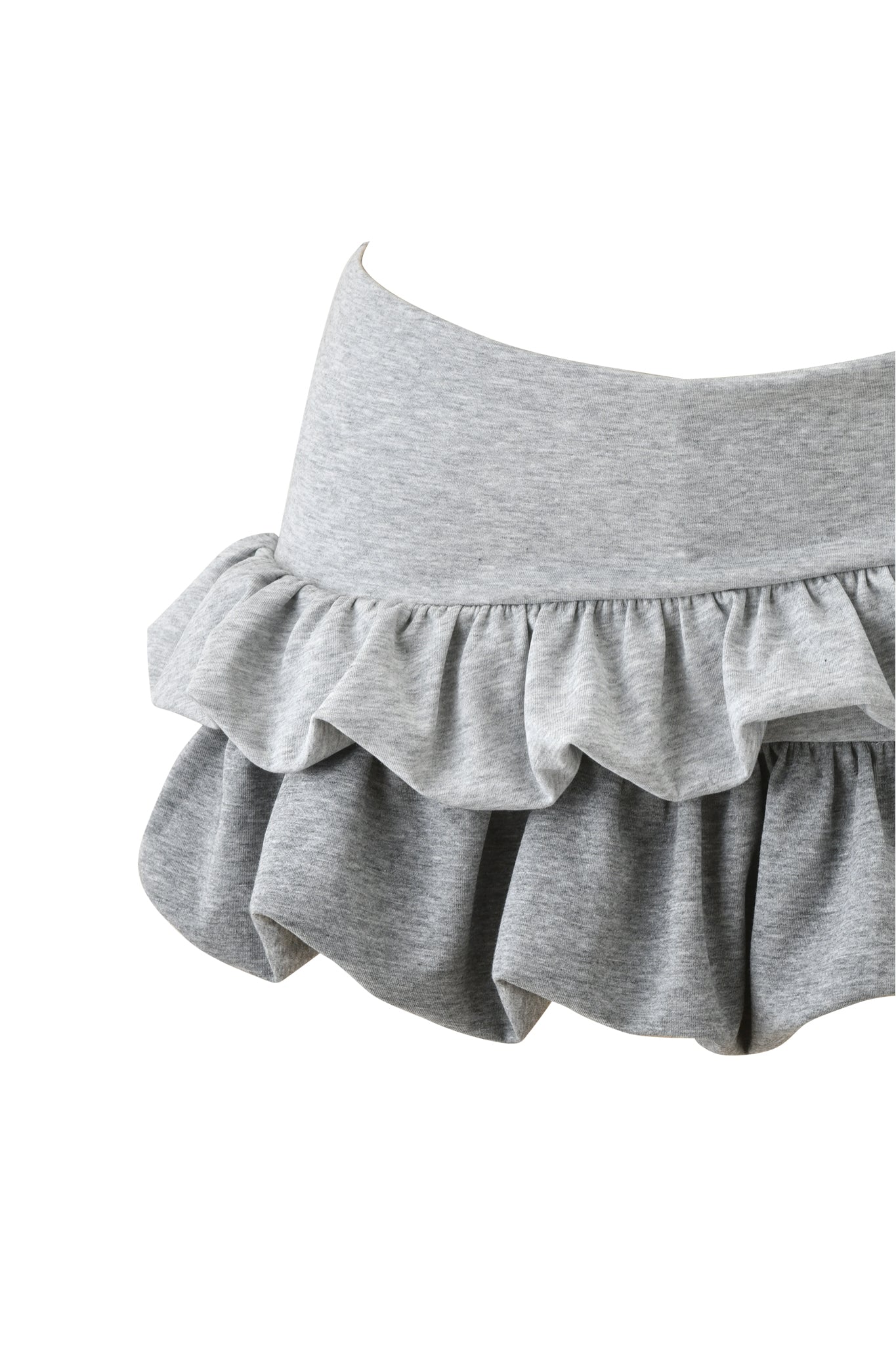 A close-up of the I.AM.GIA CHERRI MINI SKIRT - GREY MULTI, a light gray two-tier ruffle skirt with an elastic waistband, shown against a white background.