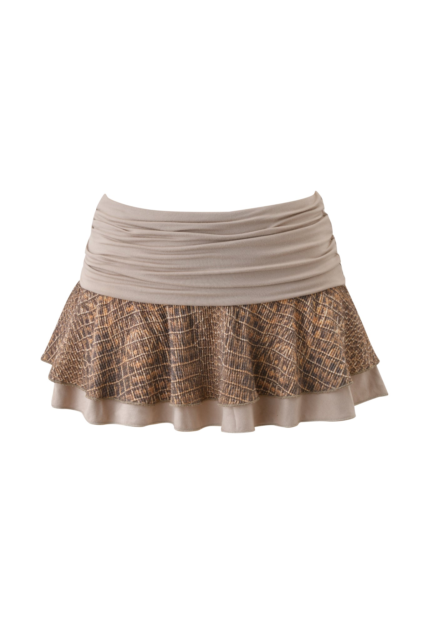 The ECHO WAFFLE MINI SKIRT - REPTILIA by I.AM.GIA features a beige ruffled mini design with a cotton jersey waistband and a flared, double-layered hem. The lower ruffle showcases a brown textured, crisscross reptilia pattern for feminine appeal.
