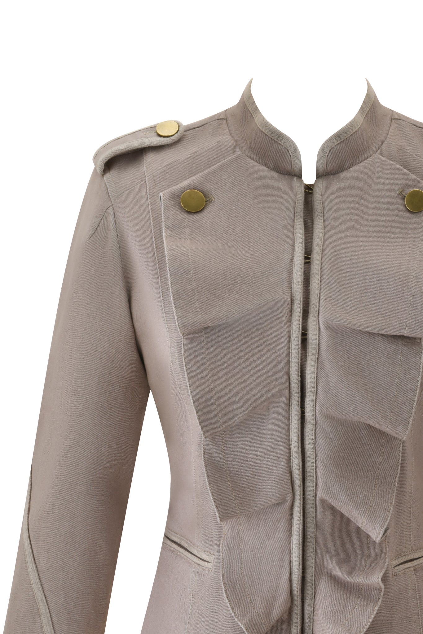 A close-up of the I.AM.GIA SHARN JACKET in Mushroom, showcasing a structured military-inspired design with front ruffle details, gold shoulder epaulette buttons, and a collarless neckline.