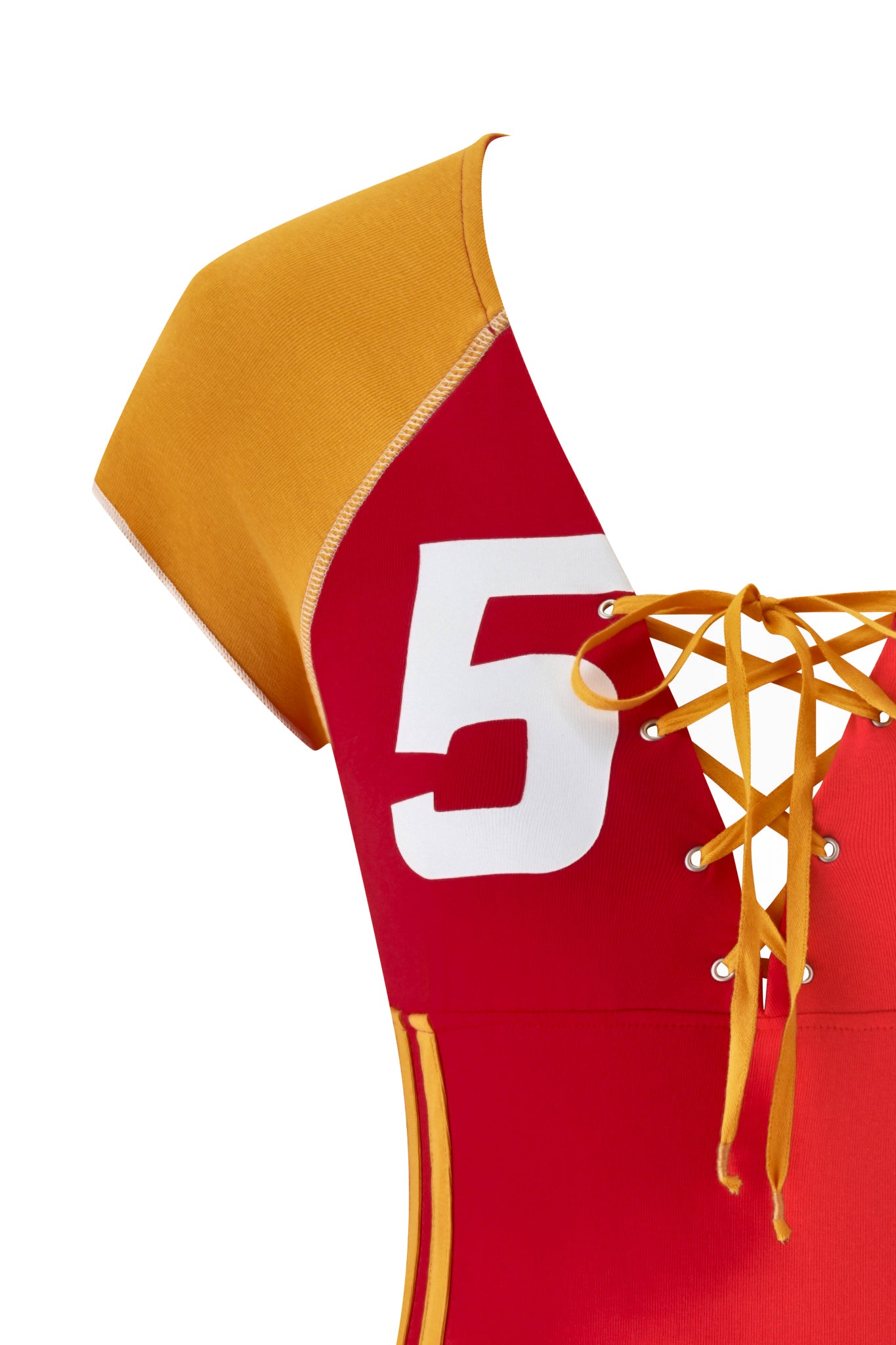 Close-up of the I.AM.GIA NOVIA Lace-Up T-Shirt and Headband in red, featuring a stretch cotton soccer jersey style, lace-up front with orange-yellow laces, white number 5 print, and yellow sleeve details.