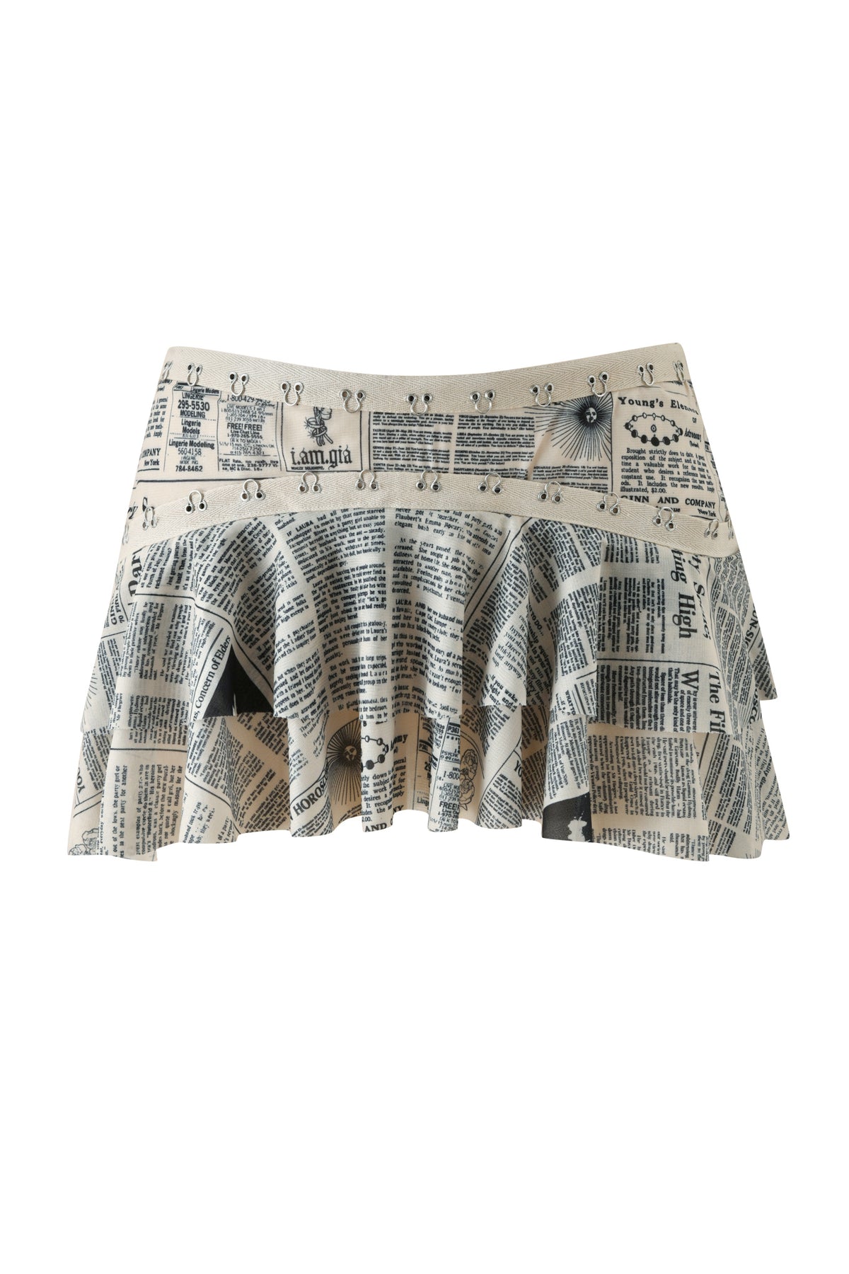 Sure! Here’s your rewritten sentence using the provided product data: The SORA MINI SKIRT - LEFT ON READ by I.AM.GIA is a pleated, low-rise mini skirt featuring a beige base with a distinctive black newspaper print design showcasing various articles and headlines.