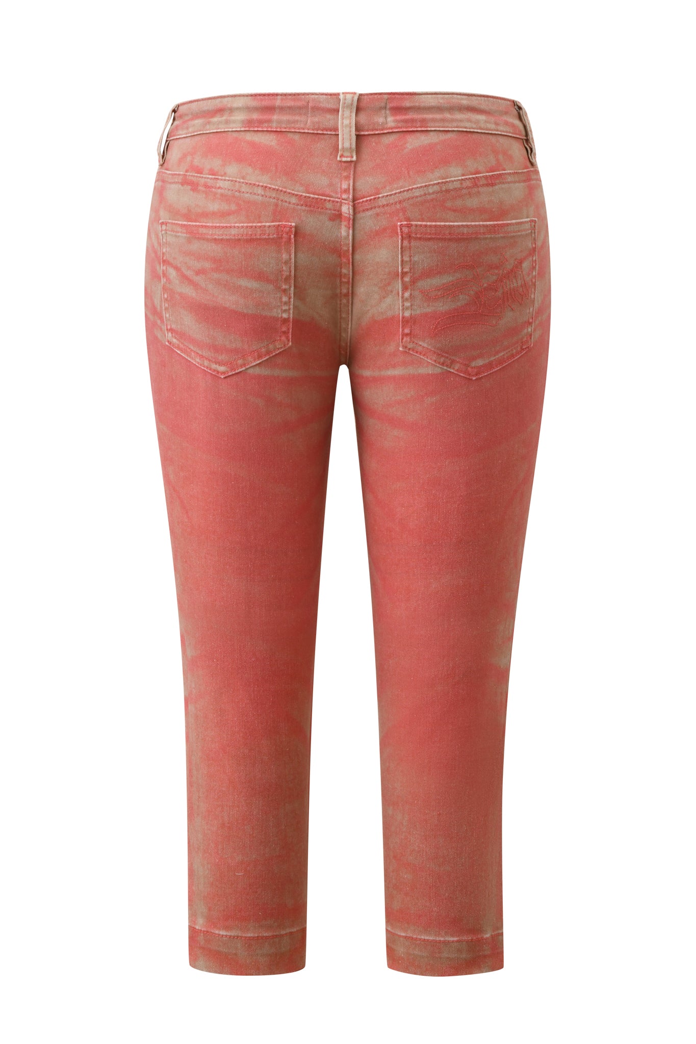 The back view of the SUNSET CAPRI JEAN - PEACH by I.AM.GIA showcases cropped, high-waisted jeans in a red-pink hue with a peach ombré wash and a subtly faded, distressed finish. Made from stretch denim, these jeans feature two back pockets and belt loops, photographed against a white background.