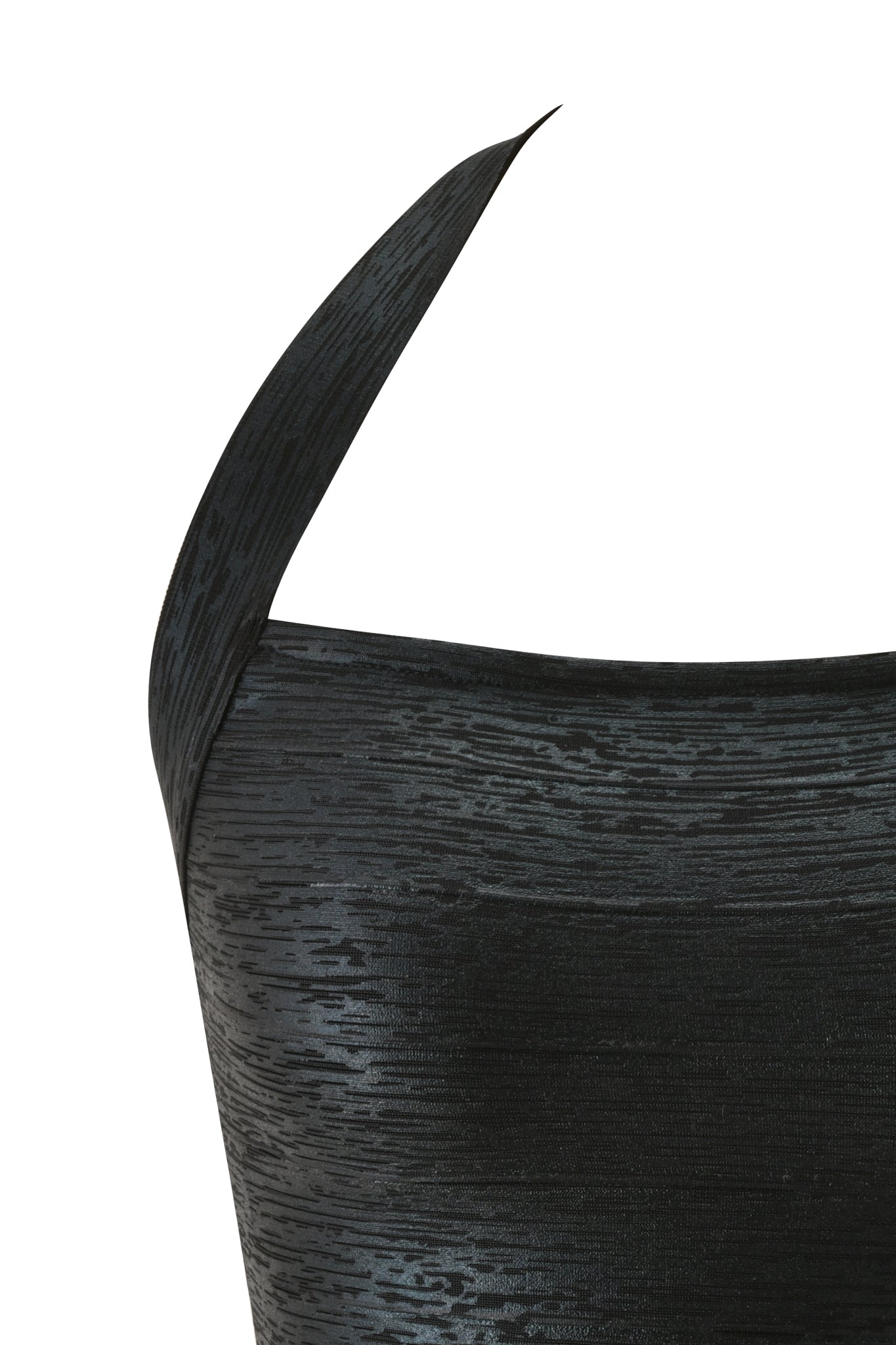 Close-up of the I.AM.GIA AIDEN PLATINUM BANDAGE TOP in black, featuring a textured, shiny finish and a single wide strap crossing over one shoulder, set against a white background.