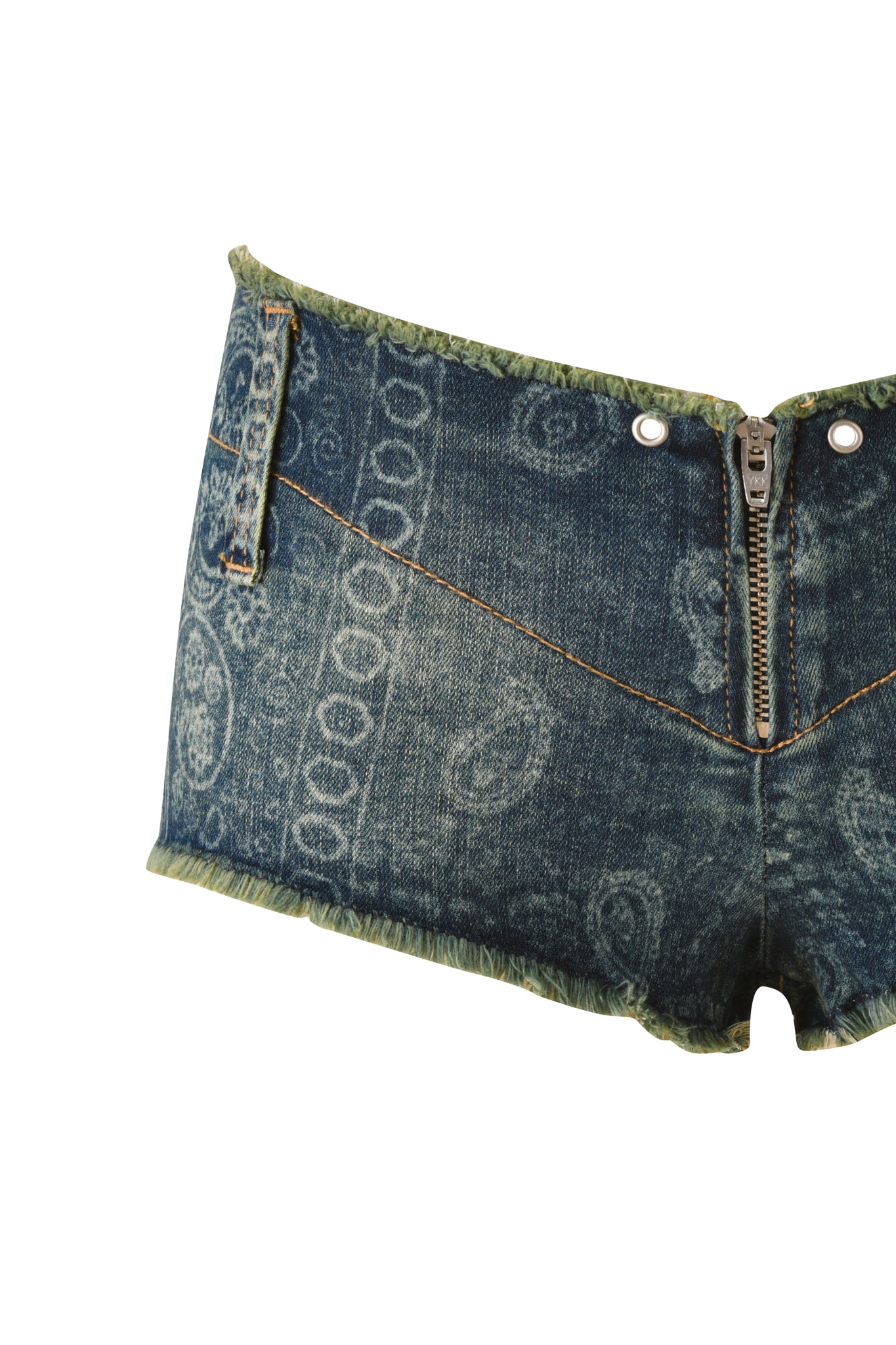 Close-up of the I.AM.GIA T-REX VEXA MICRO SHORT - BLUE BANDANA, featuring ultra low-rise denim with a zipper front, blue bandana paisley print, green trim, and visible stitching, isolated on a white background.
