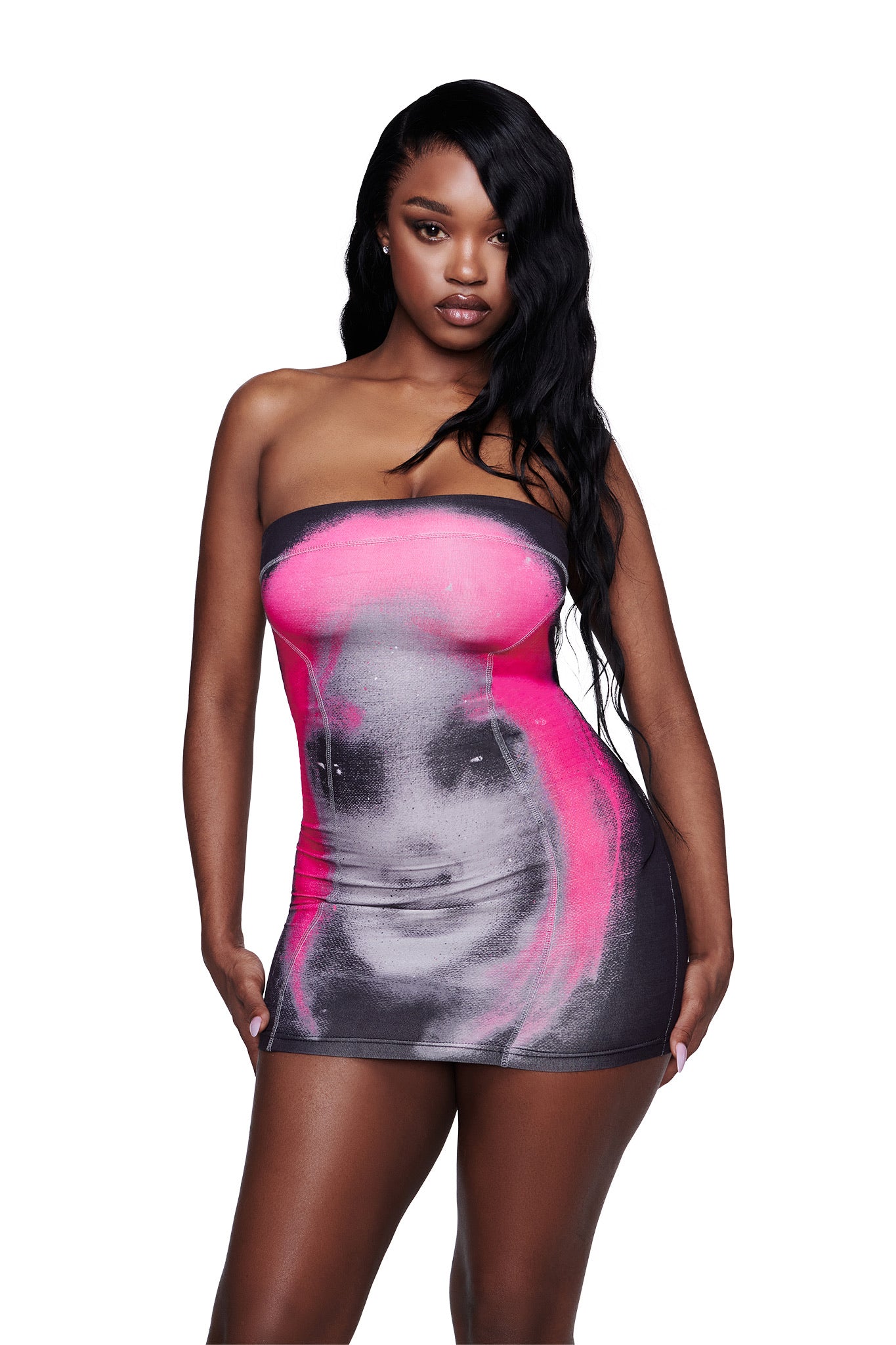 A woman wearing the I.AM.GIA T-REX BLARE BOOB TUBE MINI DRESS in black, which features a large graphic print of a woman’s face with pink hair, stands against a white background.