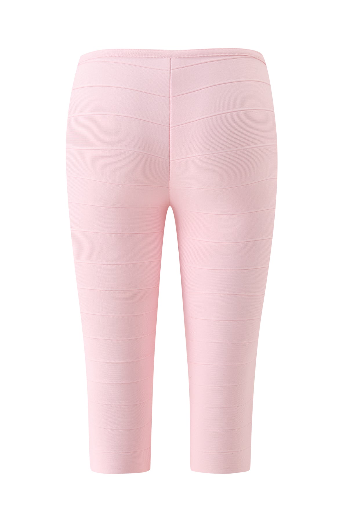 Back view of the I.AM.GIA MAEVE BANDAGE CAPRI in baby pink, featuring a bodycon fit and horizontal seam detailing. These cropped bandage capri pants reach mid-calf and are shown on a white background.