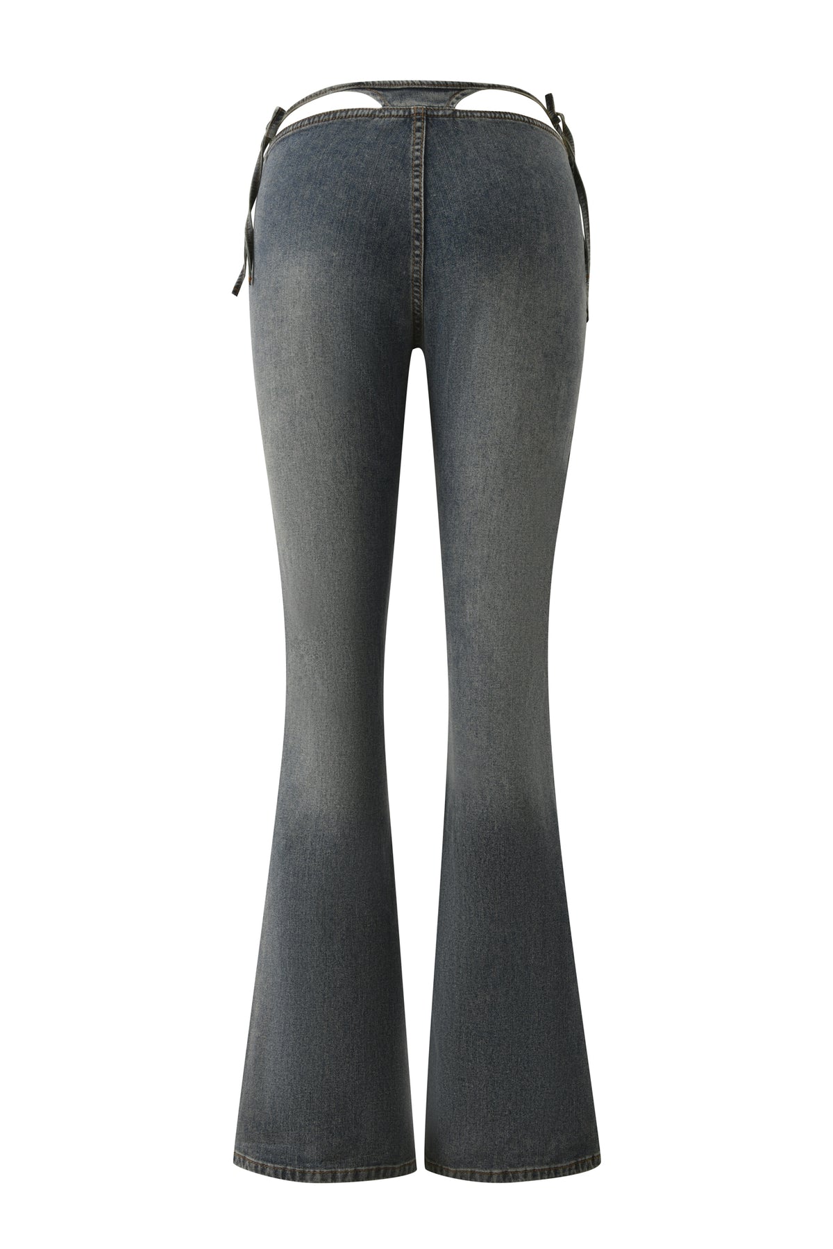 Back view of the I.AM.GIA JET G-STRING DENIM PANT in Faded Indigo, featuring a low-rise waist and black side straps with subtle G-string detailing for an iconic Y2K look, displayed on a plain white background.