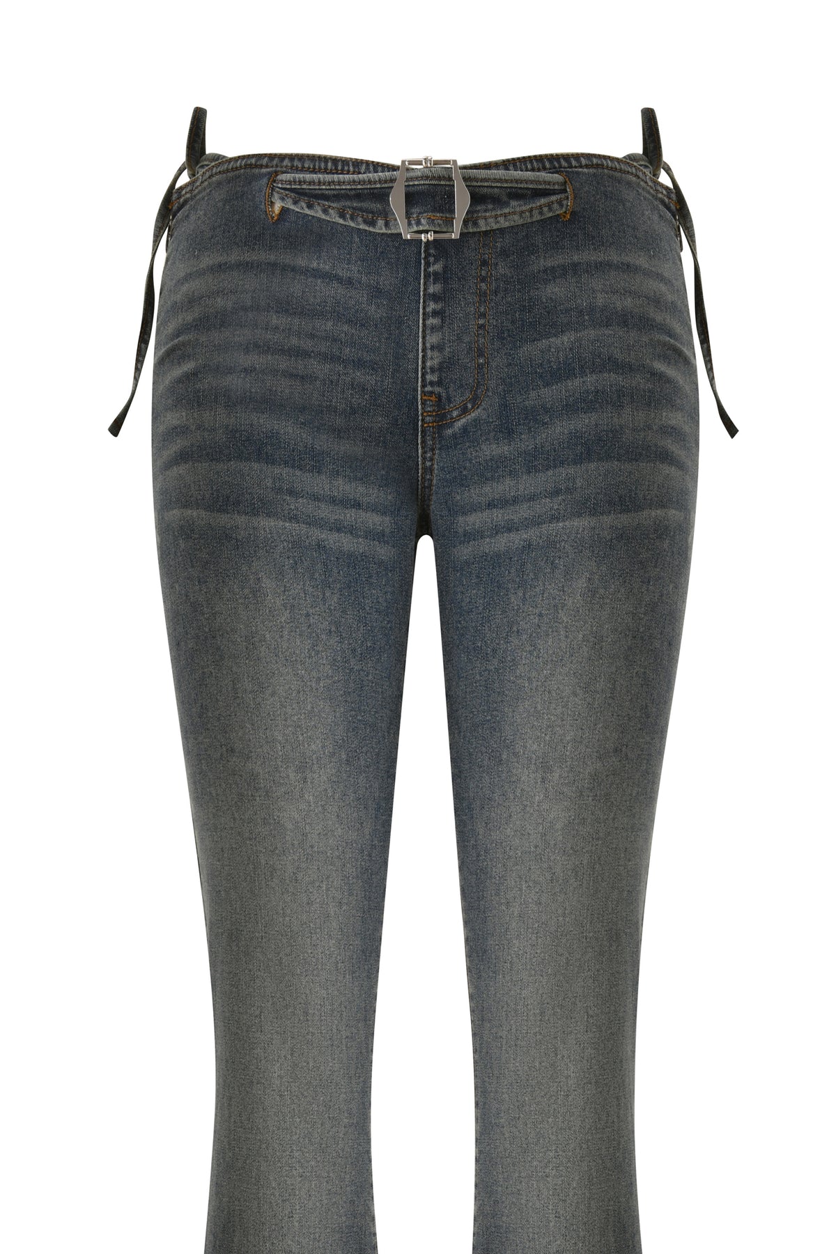 Showcased against a white background, the I.AM.GIA JET G-STRING DENIM PANT in Faded Indigo features a blue skinny silhouette with faded detailing, a front zipper and button closure, and comes paired with a slim black belt and silver buckle. Inspired by Y2K fashion trends, these low-rise jeans embody modern throwback style.