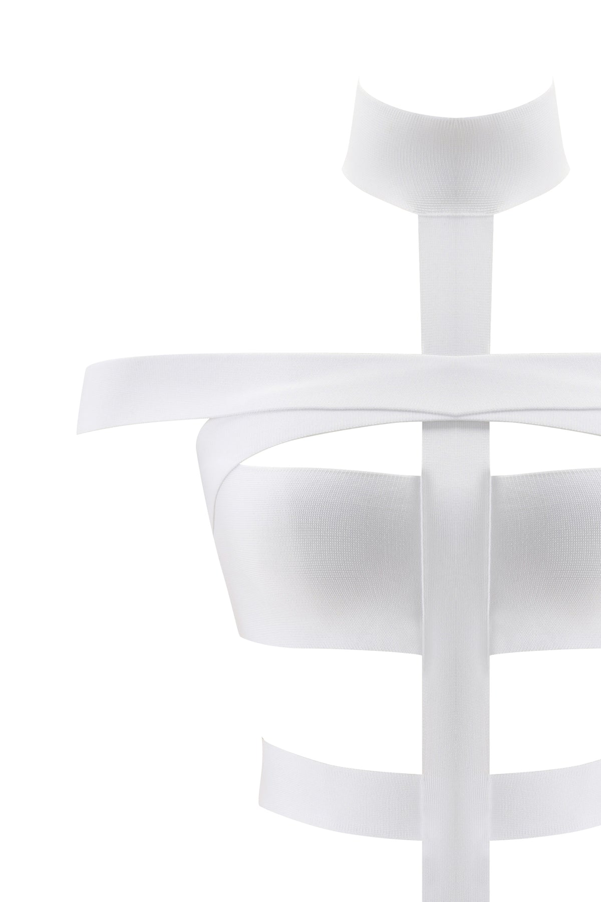 A minimalist white sculpture featuring horizontal and vertical bands evokes the abstract form of a human torso and neck, reminiscent of the I.AM.GIA QUINTA BANDAGE PLAYSUIT in white against a clean background, with a distinctively sci-fi aesthetic.