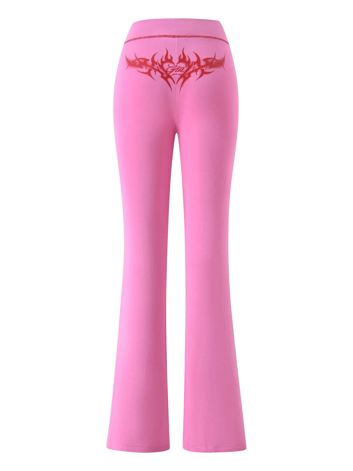 The I.AM.GIA T-REX SPRAY BODY BLARE TRACKPANT - PINK features bright pink flared pants with a red tribal heart on the back waistband, perfect for airport style, shown on a white background.