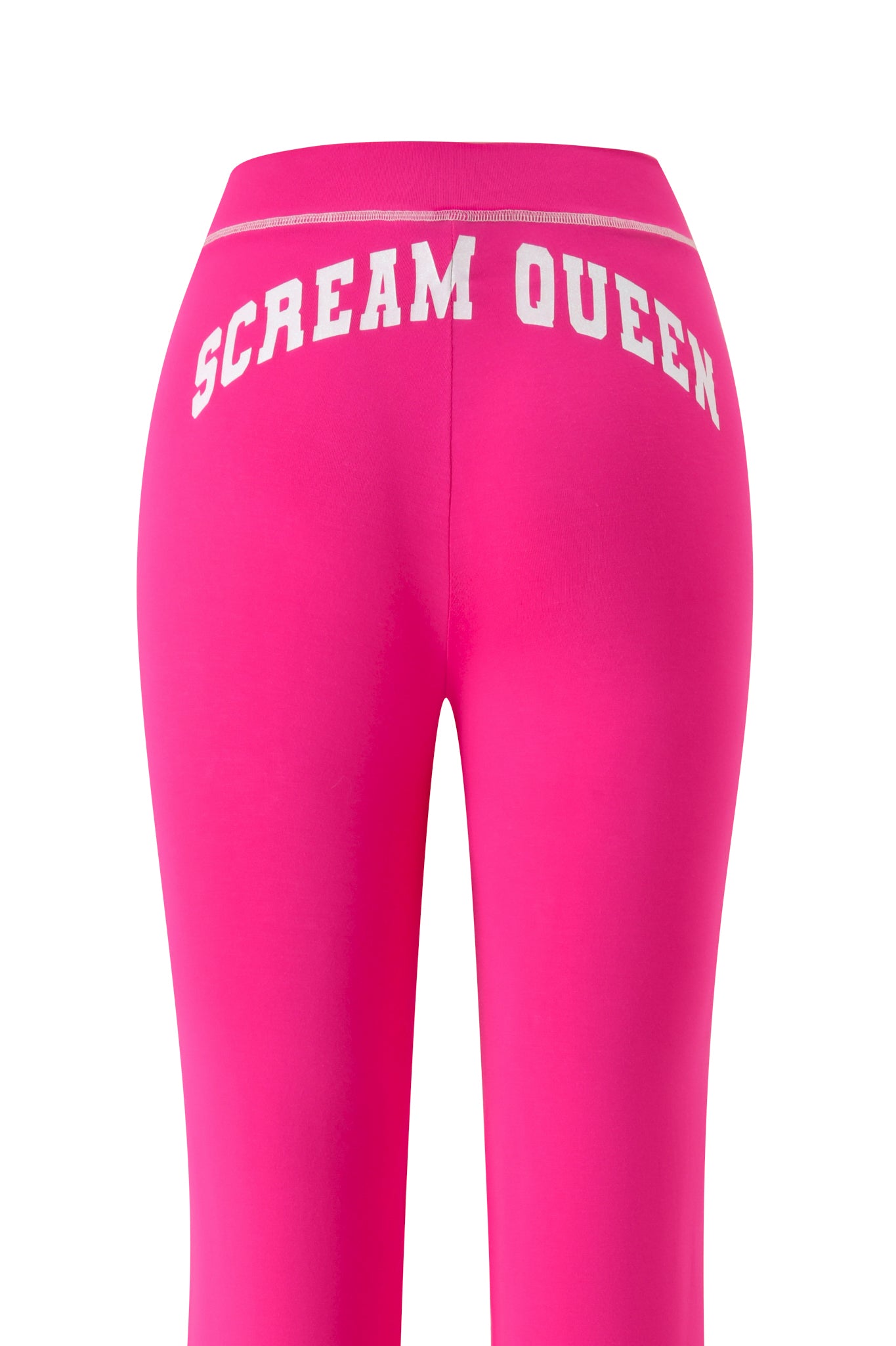 The I.AM.GIA BLARE TRACKPANT - HOT PINK SCREAM QUEEN leggings in vibrant hot pink are shown from the back, showcasing a striking white “SCREAM QUEEN” graphic across the waistband.