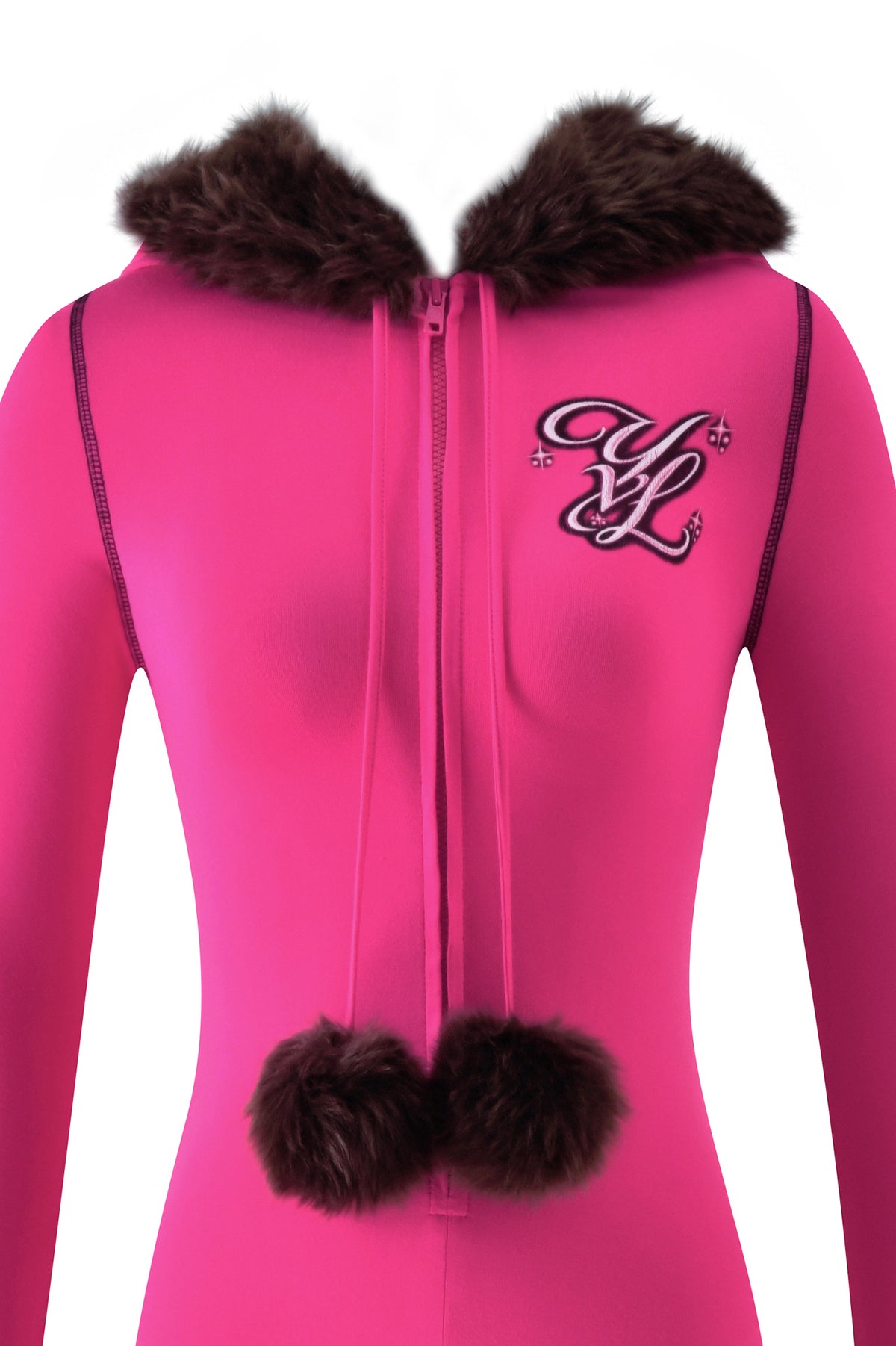 YVL BLARE FUR LINED JUMPSUIT - PINK in bright pink with a dark brown faux fur hood, flare leg silhouette, two matching pom-poms on the zipper pull, and a decorative “YL” logo patch on the chest.