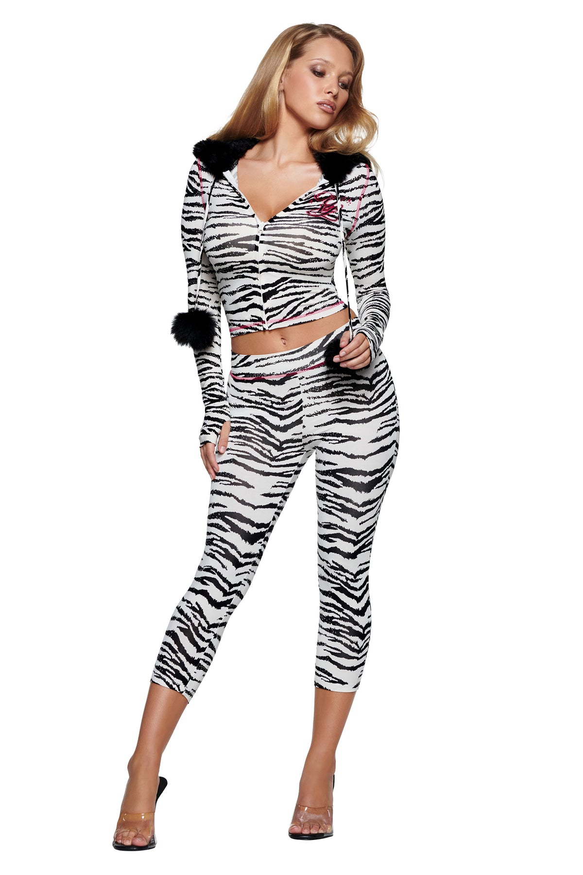 A woman wears an I.AM.GIA YVL BLARE FUR LINED HOODIE - ZEBRA with a faux fur-lined hood and matching cropped leggings.