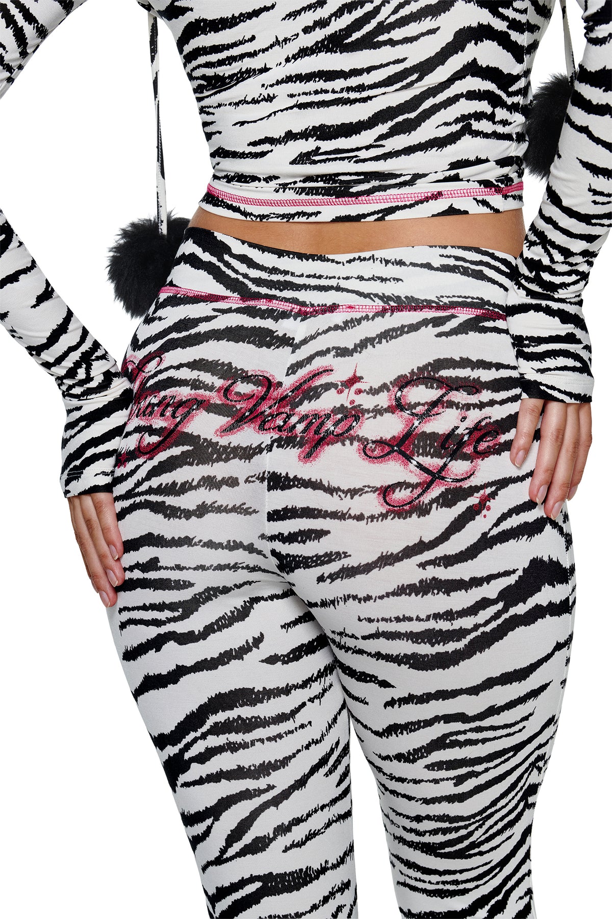 I.AM.GIA YVL BLARE CAPRI - ZEBRA leggings in bamboo fabrication with pink stitching and the phrase “Vamp Life” embroidered in pink script across the back.