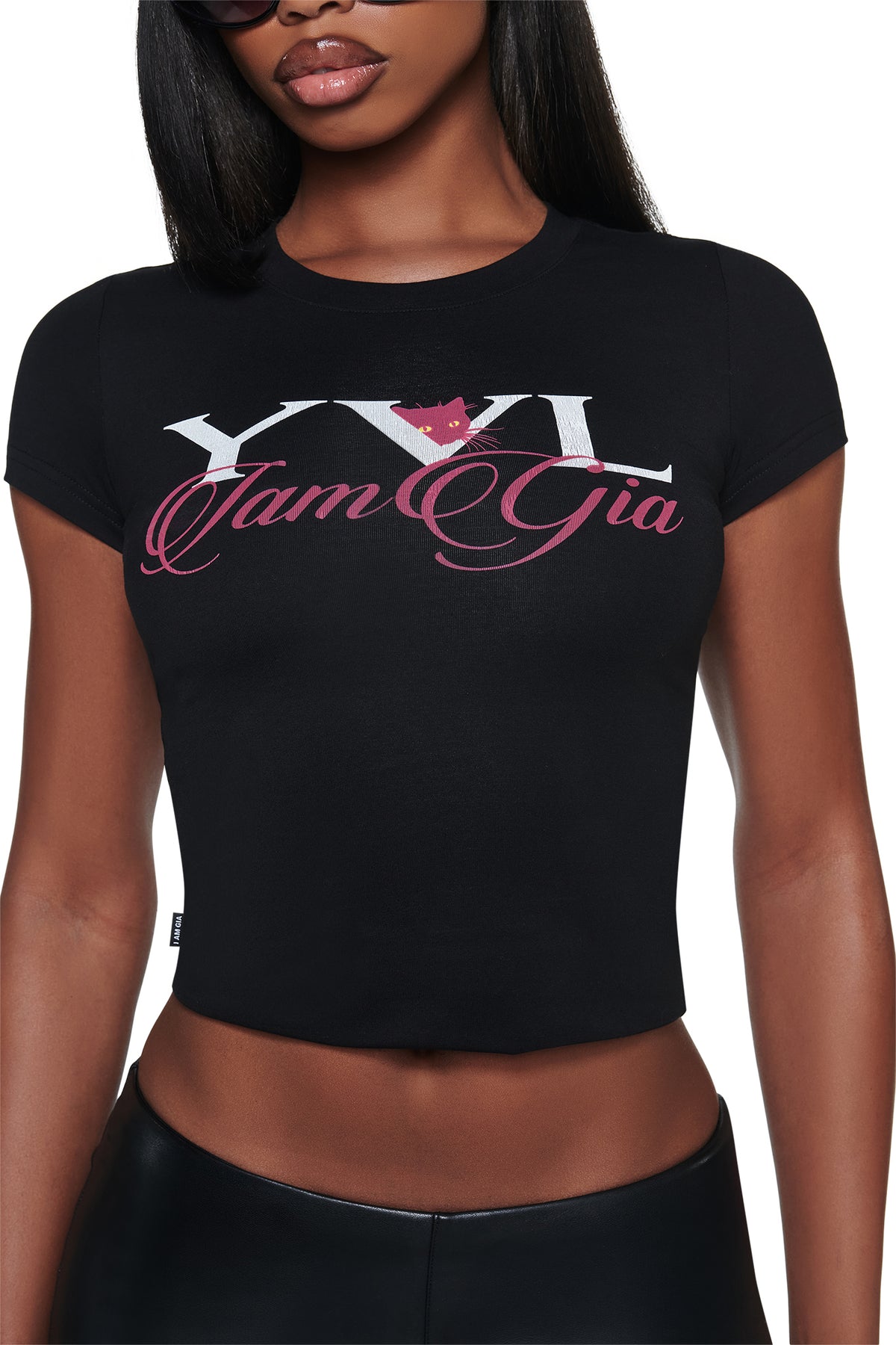 A black, cropped, short-sleeve YVL T-SHIRT - BLACK CAT featuring a cat illustration integrated into white and pink Young Vamp Life graphic text on the chest.