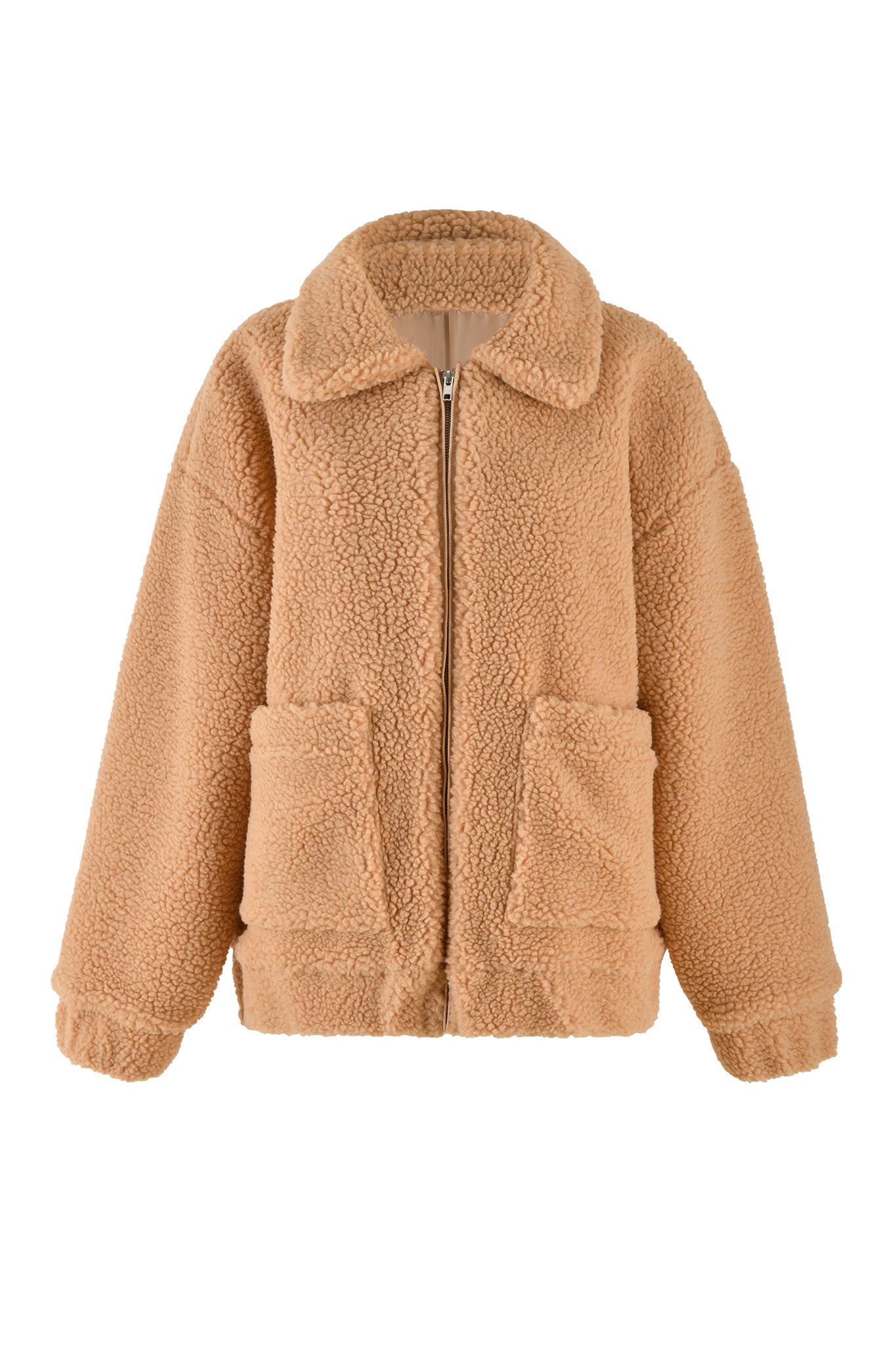 The PIXIE COAT - CARAMEL by I.AM.GIA is a tan-colored plush shearling jacket with a front zipper closure, large side pockets, and a cozy collar. Featuring a relaxed fit, dropped shoulders, and ribbed cuffs, it offers a warm and fluffy appearance.