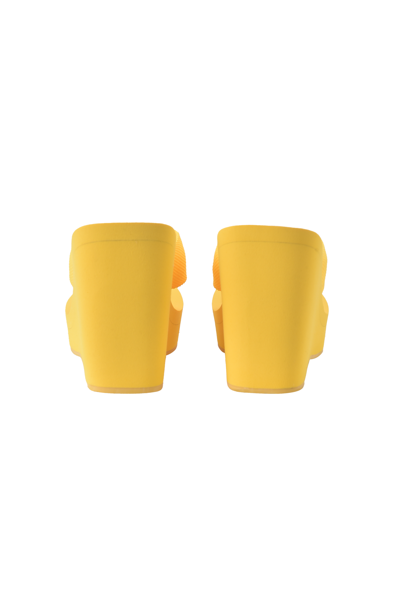 A pair of bright yellow I.AM.GIA SHELBY FLIP FLOP sandals, shown from the back against a plain background with even lighting—ideal for fans of standout color and stylish footwear.