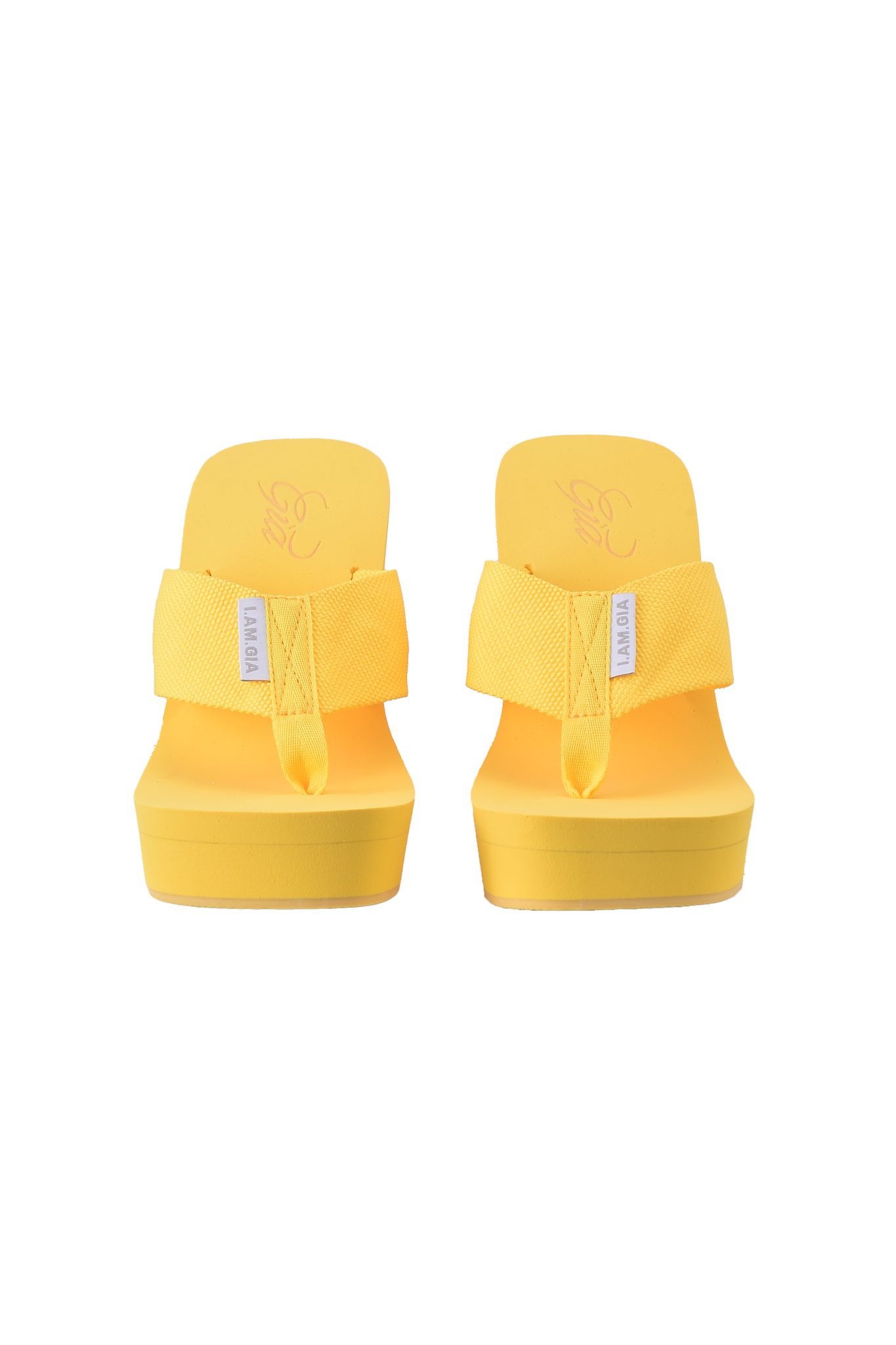 The I.AM.GIA SHELBY FLIP FLOP in yellow features thick straps and chunky wedge soles, shown from the front against a light background.