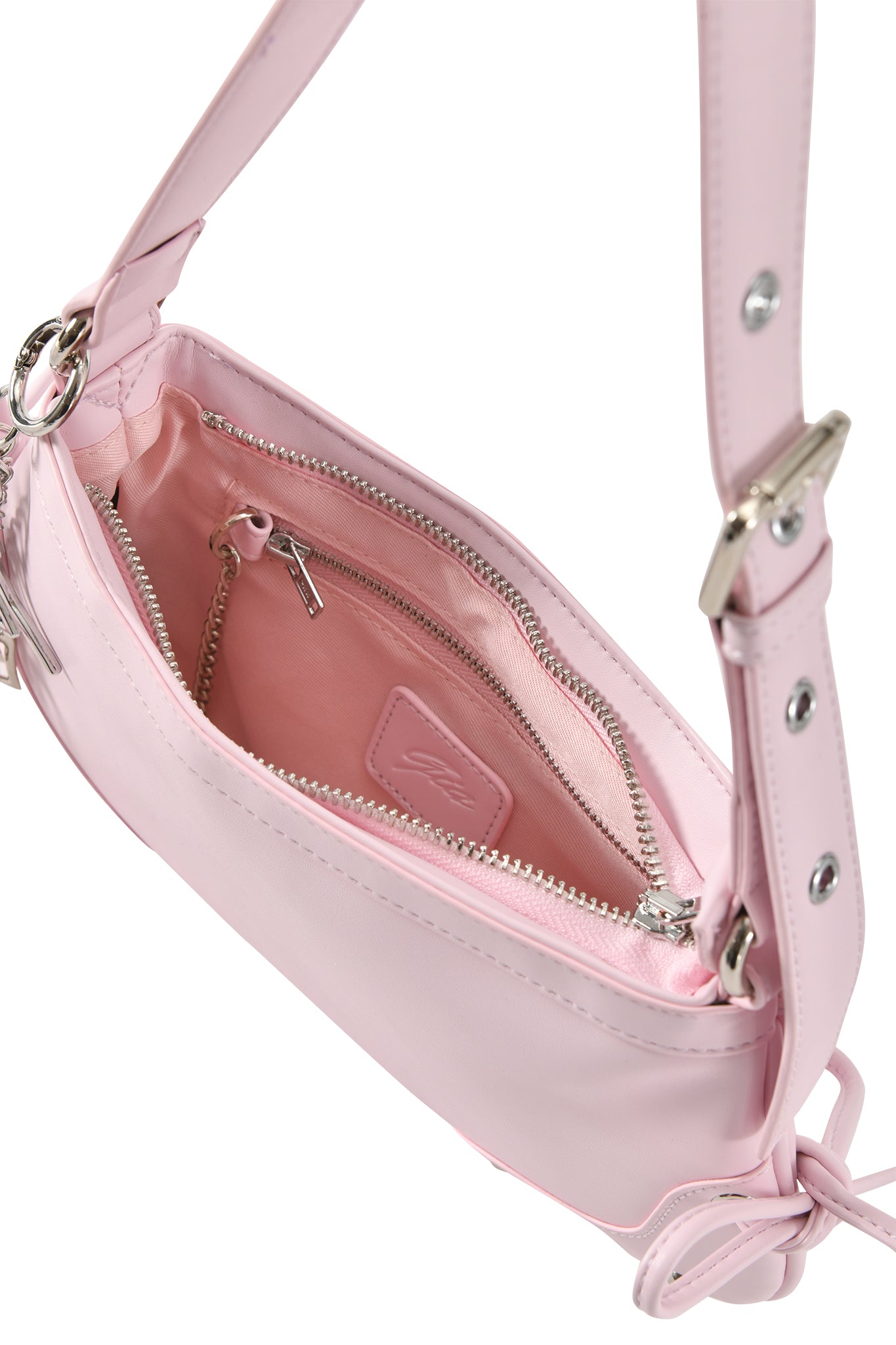 The I.AM.GIA HAYLEY BAG in baby pink is a faux leather shoulder purse with silver zippers, hardware, a main compartment, an inner zippered pocket, and adjustable straps with metal buckles for a custom fit.