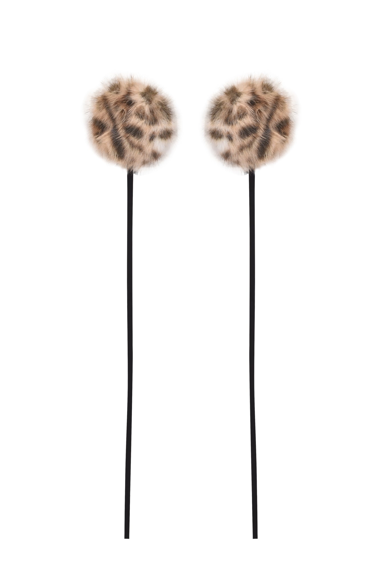 Two long black sticks with fluffy, brown-and-black spotted faux fur pom-poms, resembling the I.AM.GIA FAWN HEADPHONE COVERS - LEOPARD, set against a white background.
