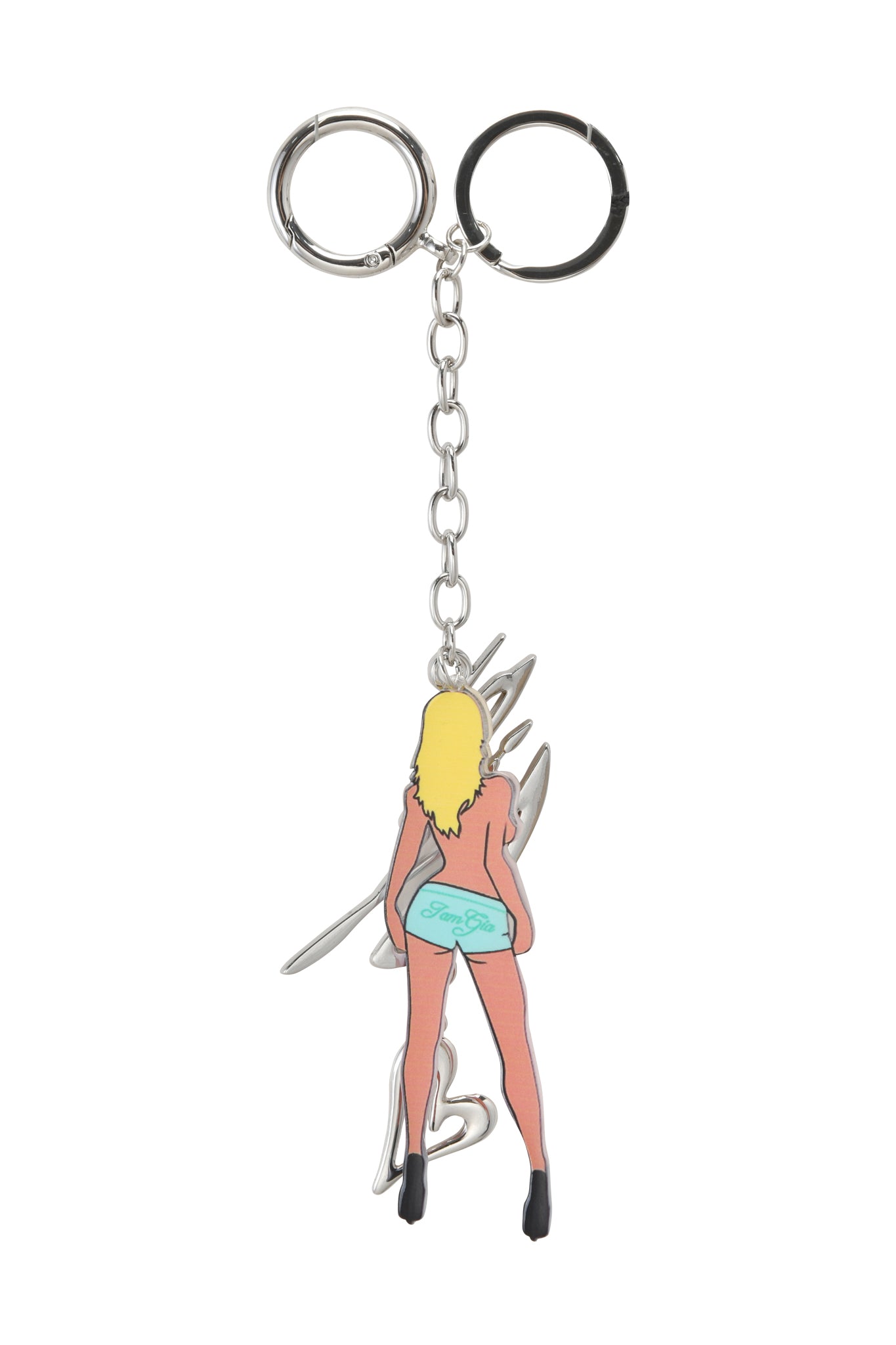 The I.AM.GIA BLARE KEYCHAIN - BLONDE features a stylized woman with long blonde hair, high heels, and teal shorts standing with her back to the viewer. Includes custom o-ring hardware for style and durability.