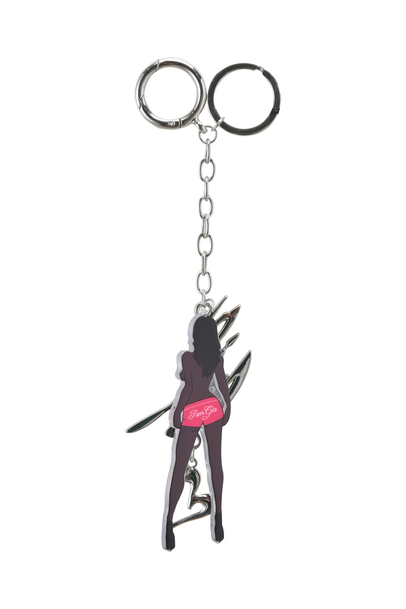 The BLARE KEYCHAIN - BRUNETTE by I.AM.GIA features a silhouette of a woman in heels and pink shorts with her back to the viewer, attached to a chain and two metal rings—an eye-catching custom silver charm for your keys.