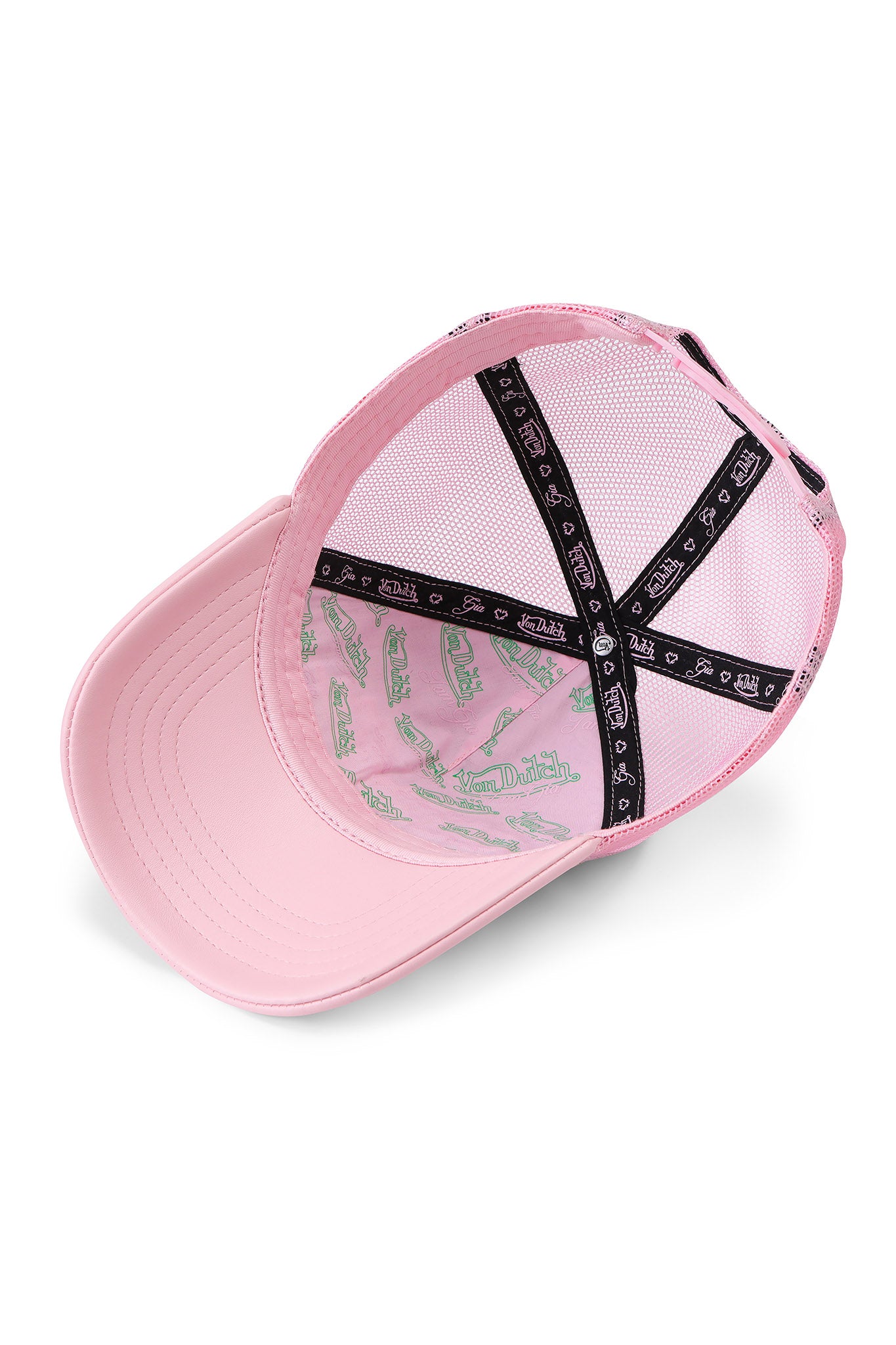 A pink mesh I.AM.GIA X VON DUTCH TRUCKER HAT - LEOPARD shown inside, with mesh panels, black-and-white patterned fabric strips, and green "Von Dutch" logos on the lining for a unique branded touch.