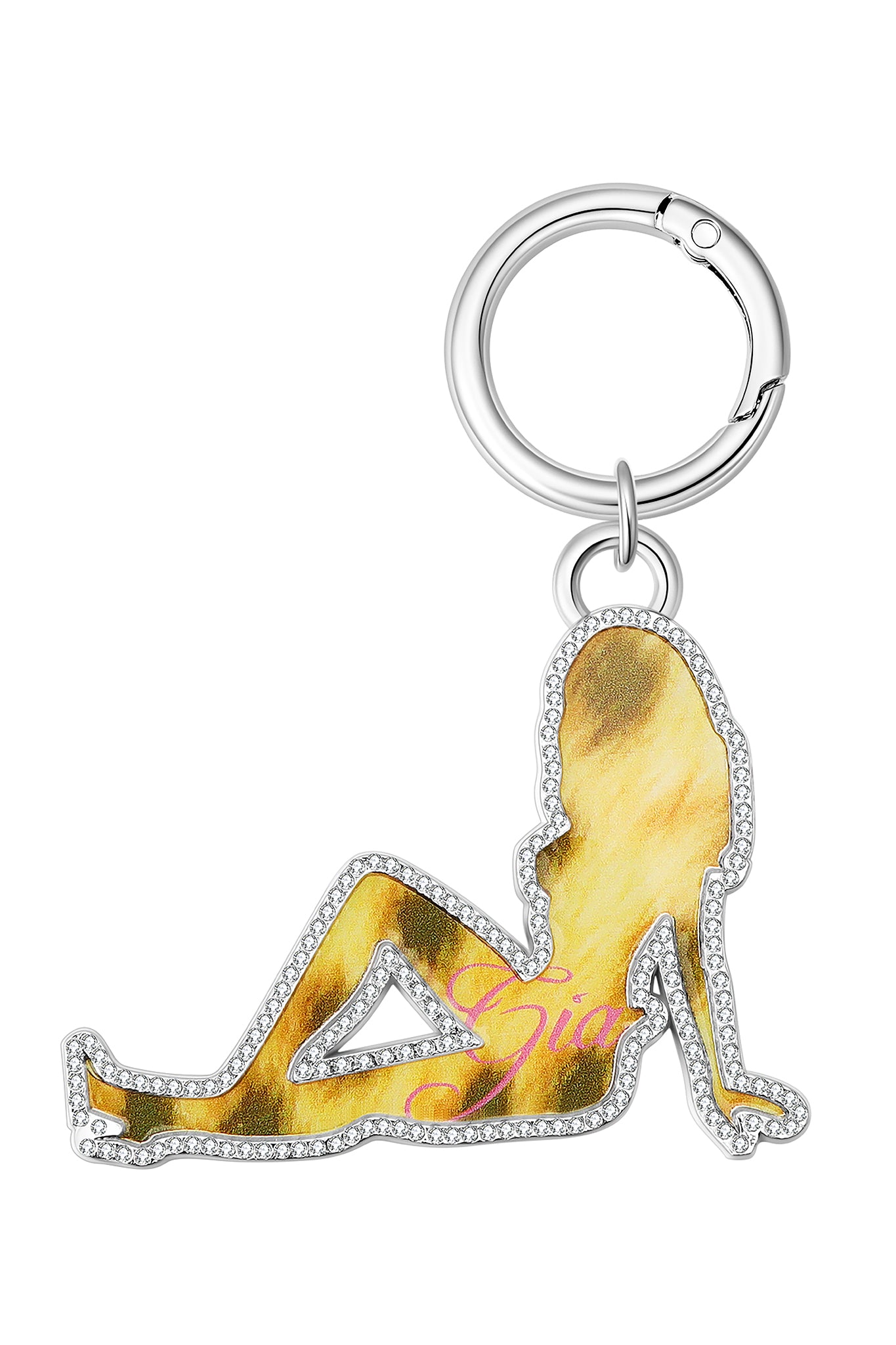 The I.AM.GIA x Von Dutch Girl Keychain features a metallic outline of a reclining woman in leopard pink, accented with rhinestones and a silver keyring—a bold Y2K-inspired accessory from I.AM.GIA.