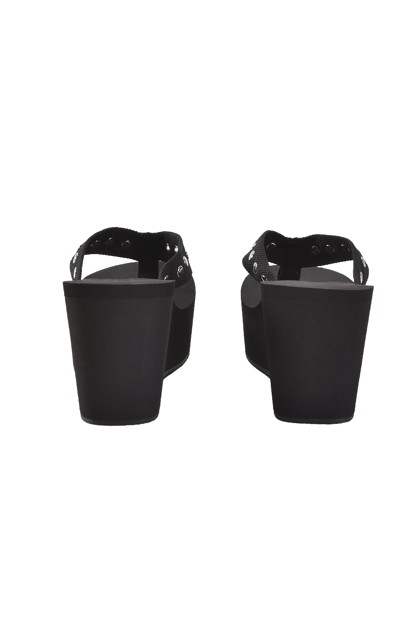 The I.AM.GIA SHELBY STUDDED FLIP FLOP 2.0 in black features a stylish back view with thick platform heels and ankle straps adorned with chic buckle details.