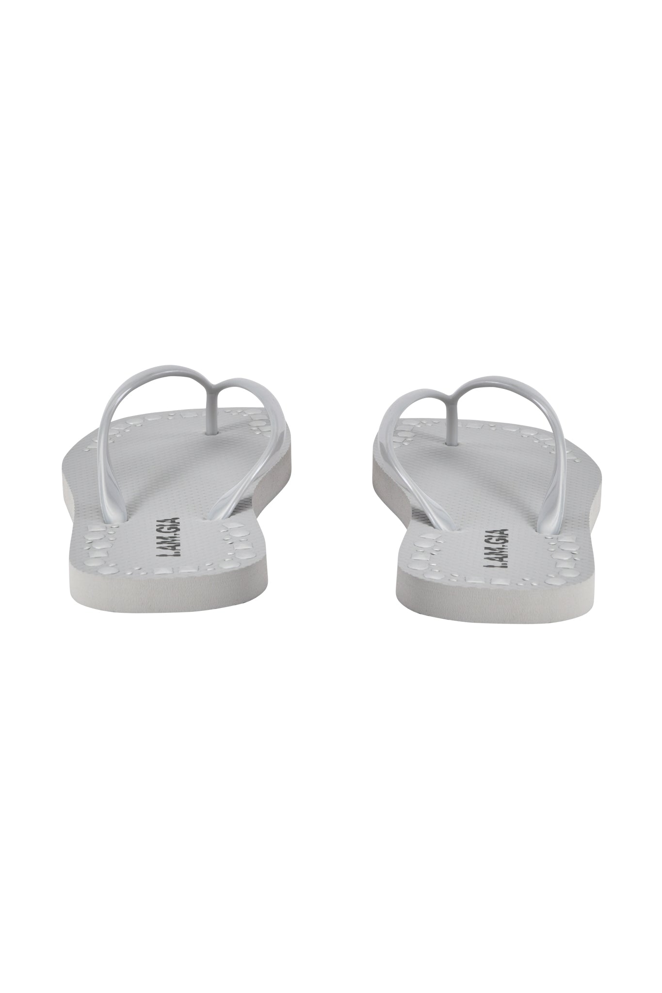 The INKA STUDDED FLIP FLOP - SILVER by I.AM.GIA features thin straps and a comfy footbed, shown from the back on a plain white background.