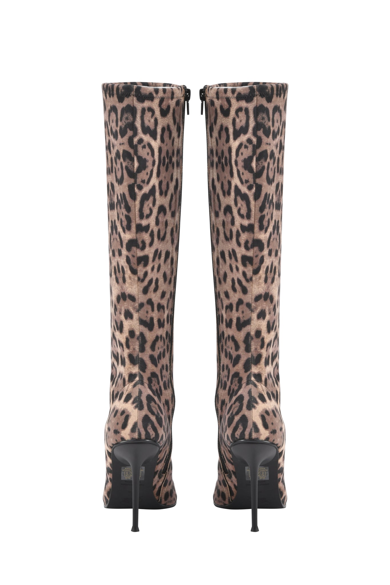 The I.AM.GIA YANA KNEE HIGH BOOTS - PANTHERA feature a bold tan and black animal print, pointed toe stiletto heels, knee-high fit, and black back zippers.
