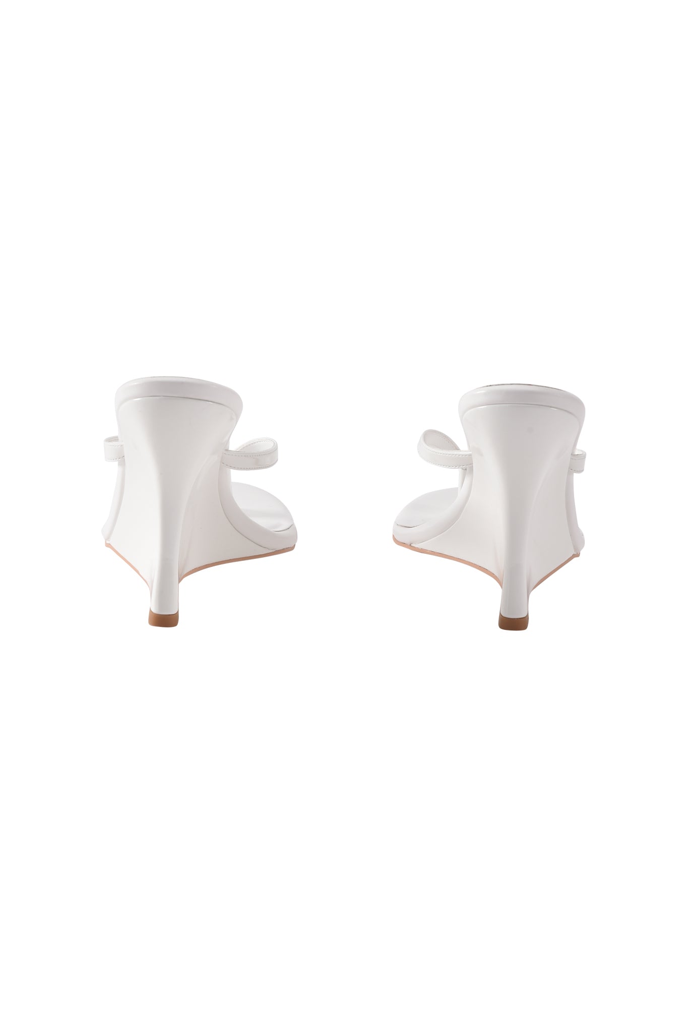 The I.AM.GIA VIKTORIA WEDGE HEEL in white features faux leather, open heels, slim high heels, and bow details on each shoe, shown side by side against a white background.