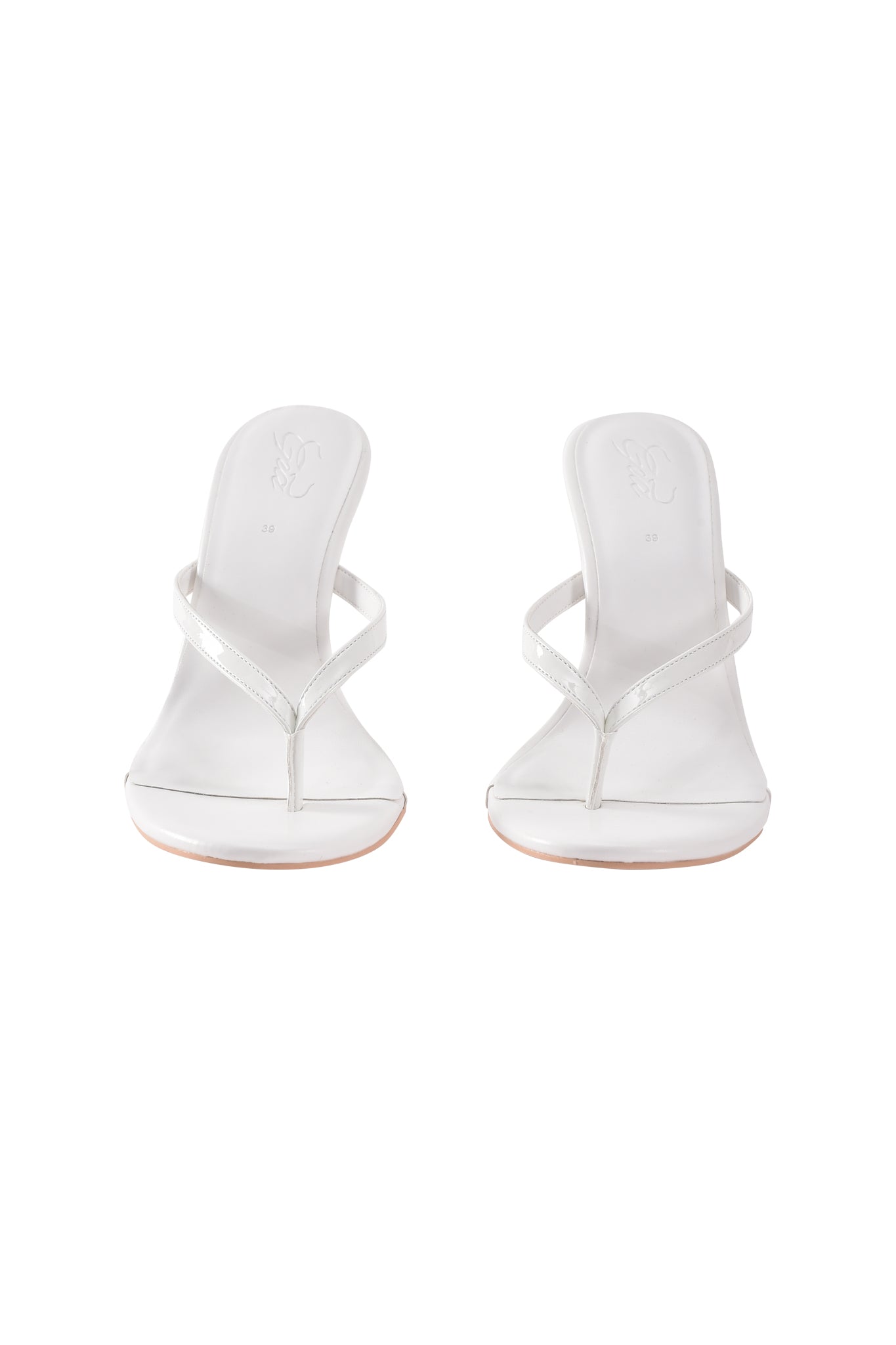 The VIKTORIA WEDGE HEEL in white by I.AM.GIA features thin faux leather thong straps, shown from the front against a white background.